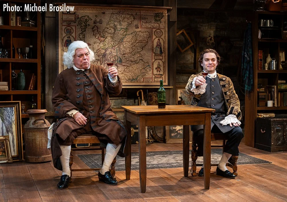Brian Mani as Samuel Johnson and Josh Krause as James Boswell having a drink.