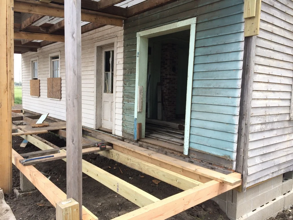 The opening shown here was originally a window. It accessed an extension of the kitchen when the lower porch was enclosed.