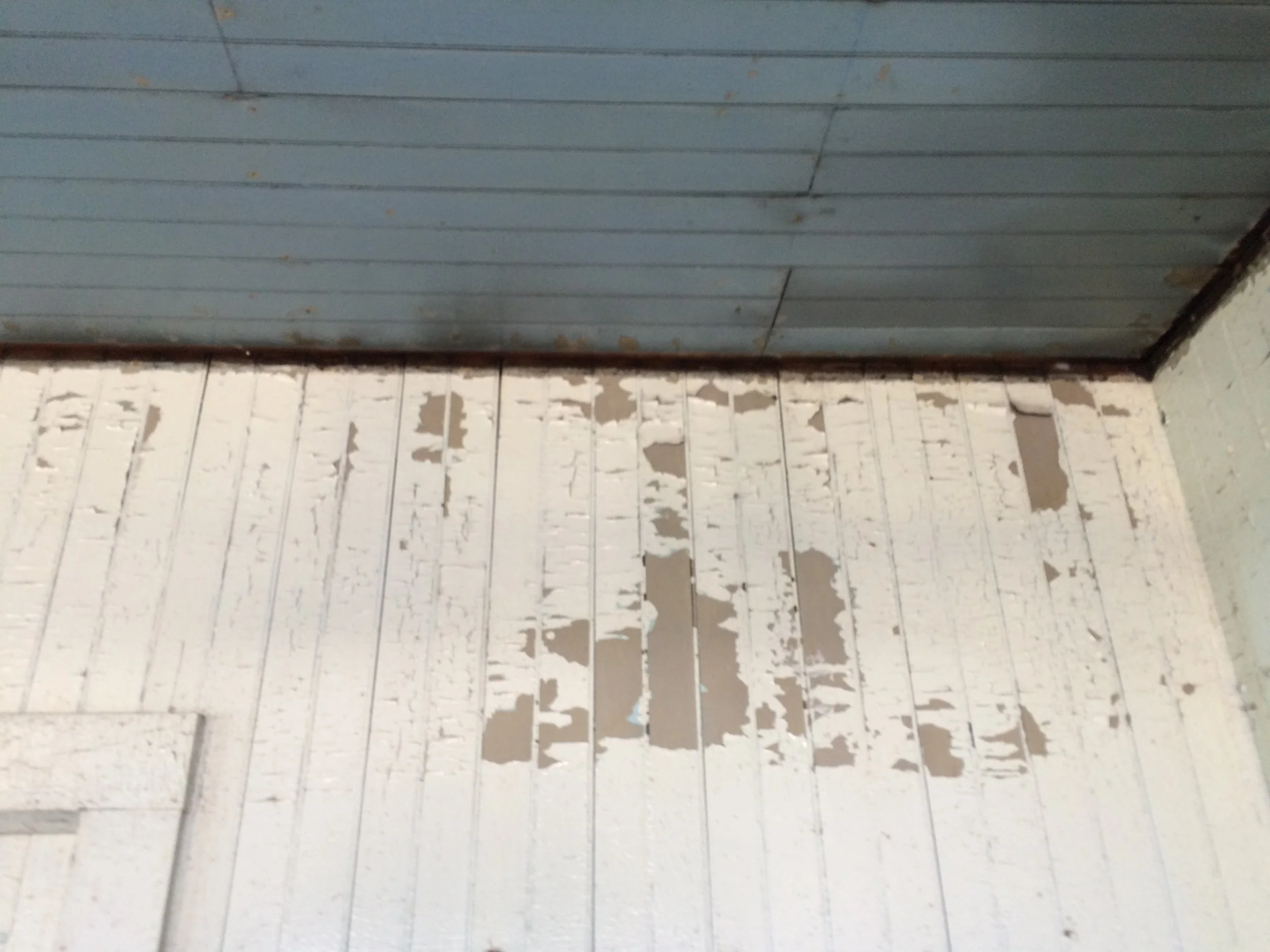 Original blue ceiling and gray wall behind the white.