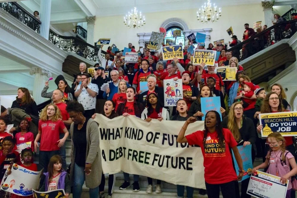 Fund Our Future Rally on May 16, group poses for photo on State House steps.