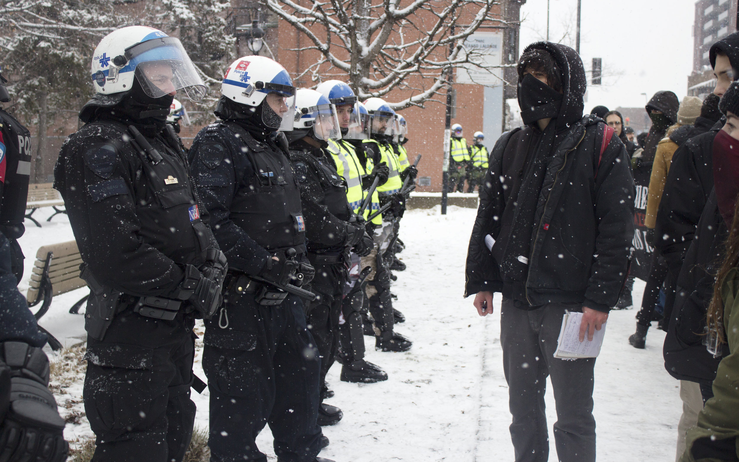  Protestor confronts a line of SPVM riot police during an anti fascist protest against PEGIDA in Montreal (February 6 2016)&nbsp; 