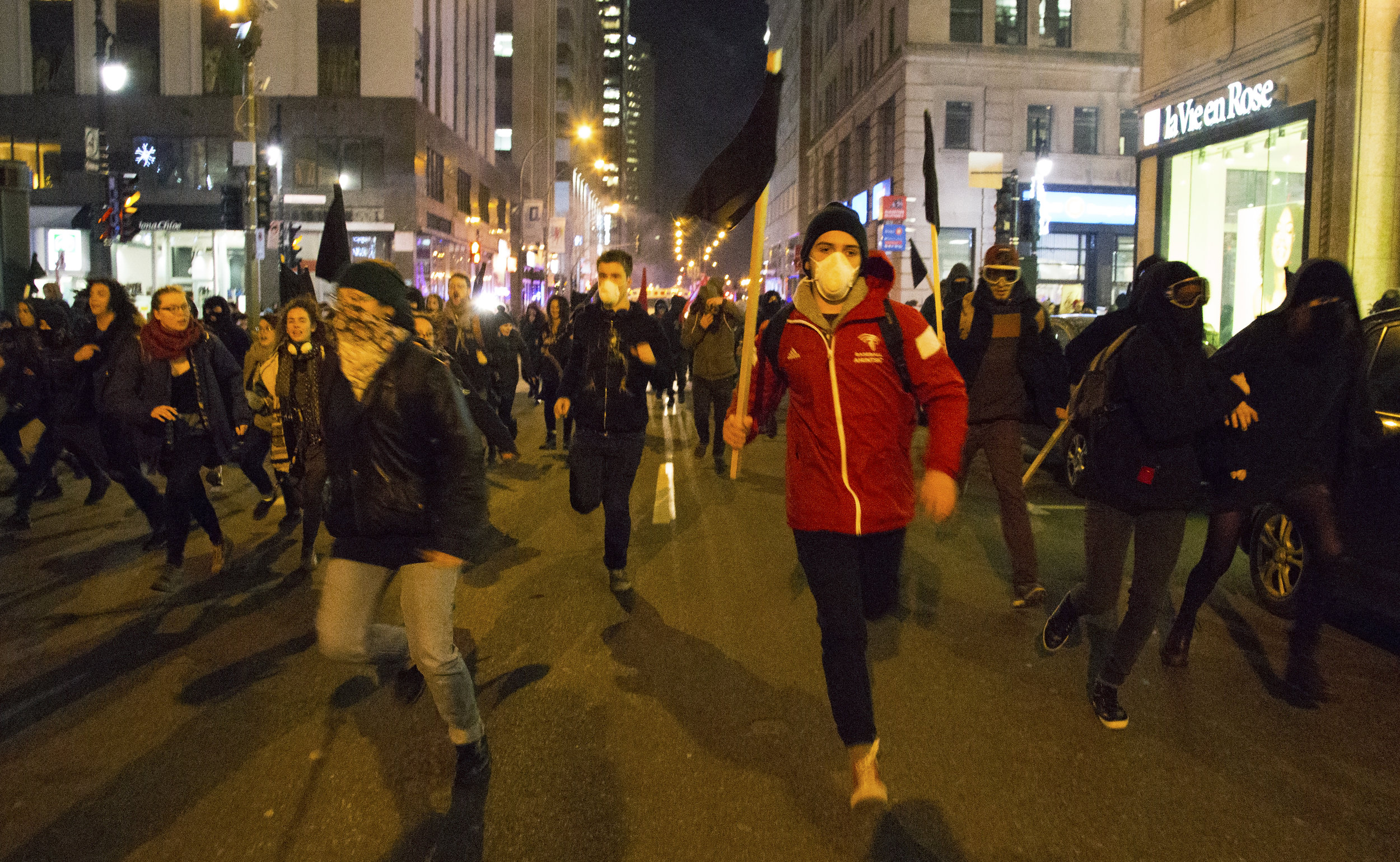  Protesters run from Montreal riot police and tear gas during a December 3 2016 anticapitalist night demonstration. &nbsp;  Full story:&nbsp;https://thelinknewspaper.ca/article/anti-austerity-demonstrators-chased-by-police-through-downtown-montreal 