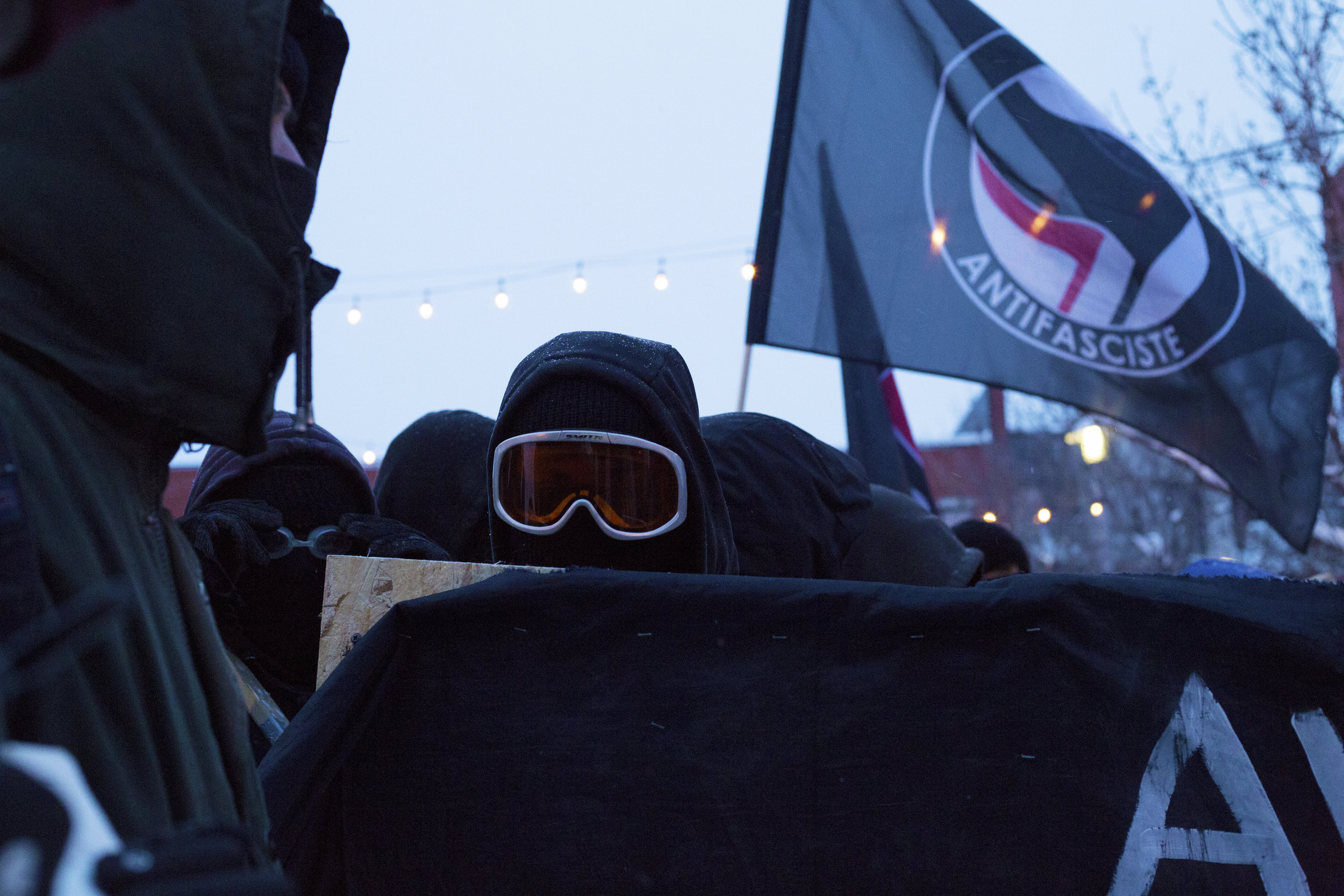  Masked protestors at a demonstration against police brutality in Montreal (March 15 2017) 