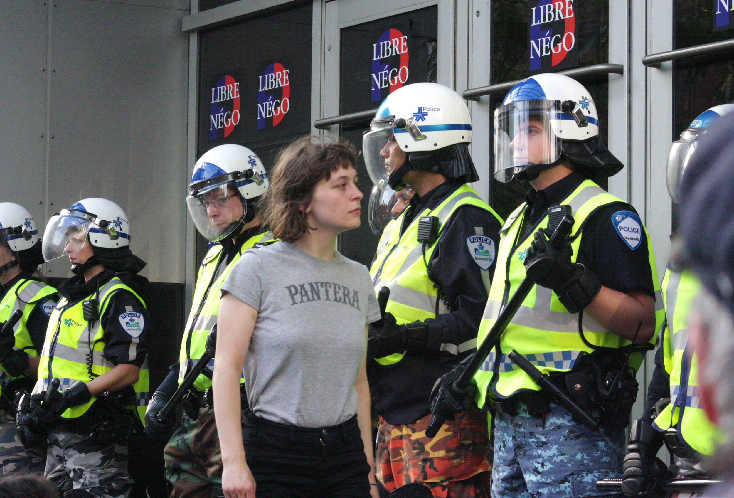  Woman stares down riot police at a silent demonstration against police brutality in Montreal (June &nbsp;9 2015) 
