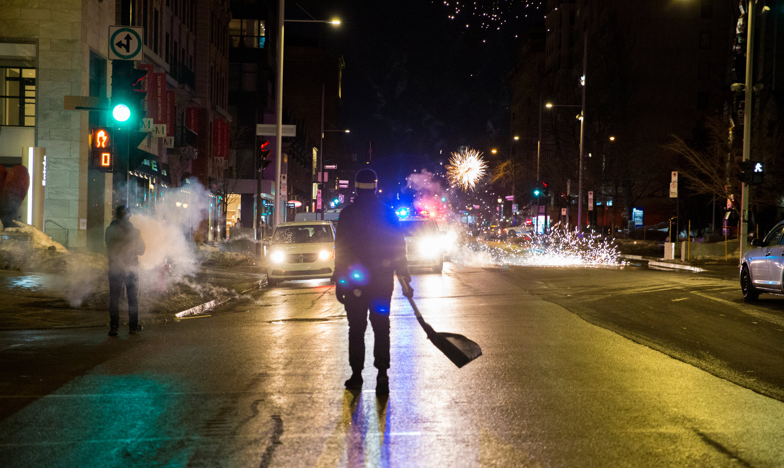  Black Bloc Protester shoots fireworks towards Montreal police at the annual march against police brutality [March 2019]   