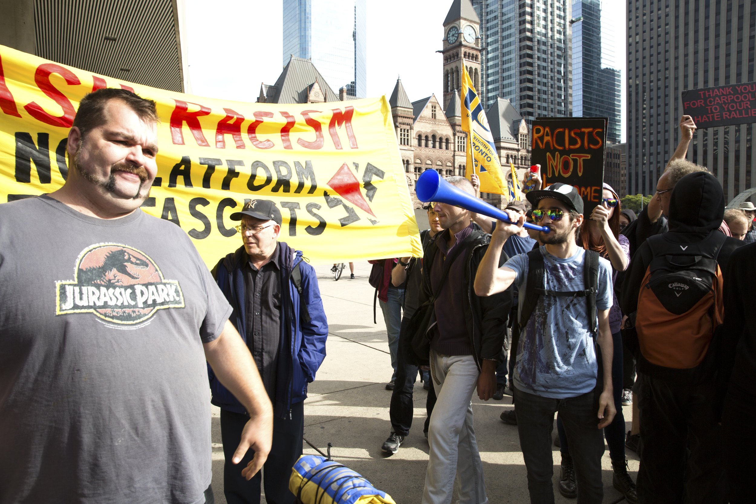  Counter protester blows a horn at a Proud Boy during a demonstration/counter demonstration in downtown Toronto. October 21, 2017. 