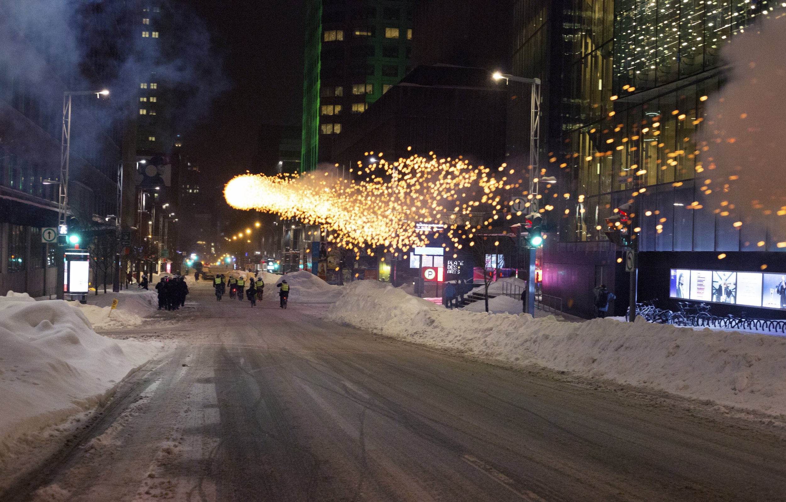  Protesters shoot a firework at Montreal Police (SPVM) during a demonstration against police brutality. March 15 2017.  