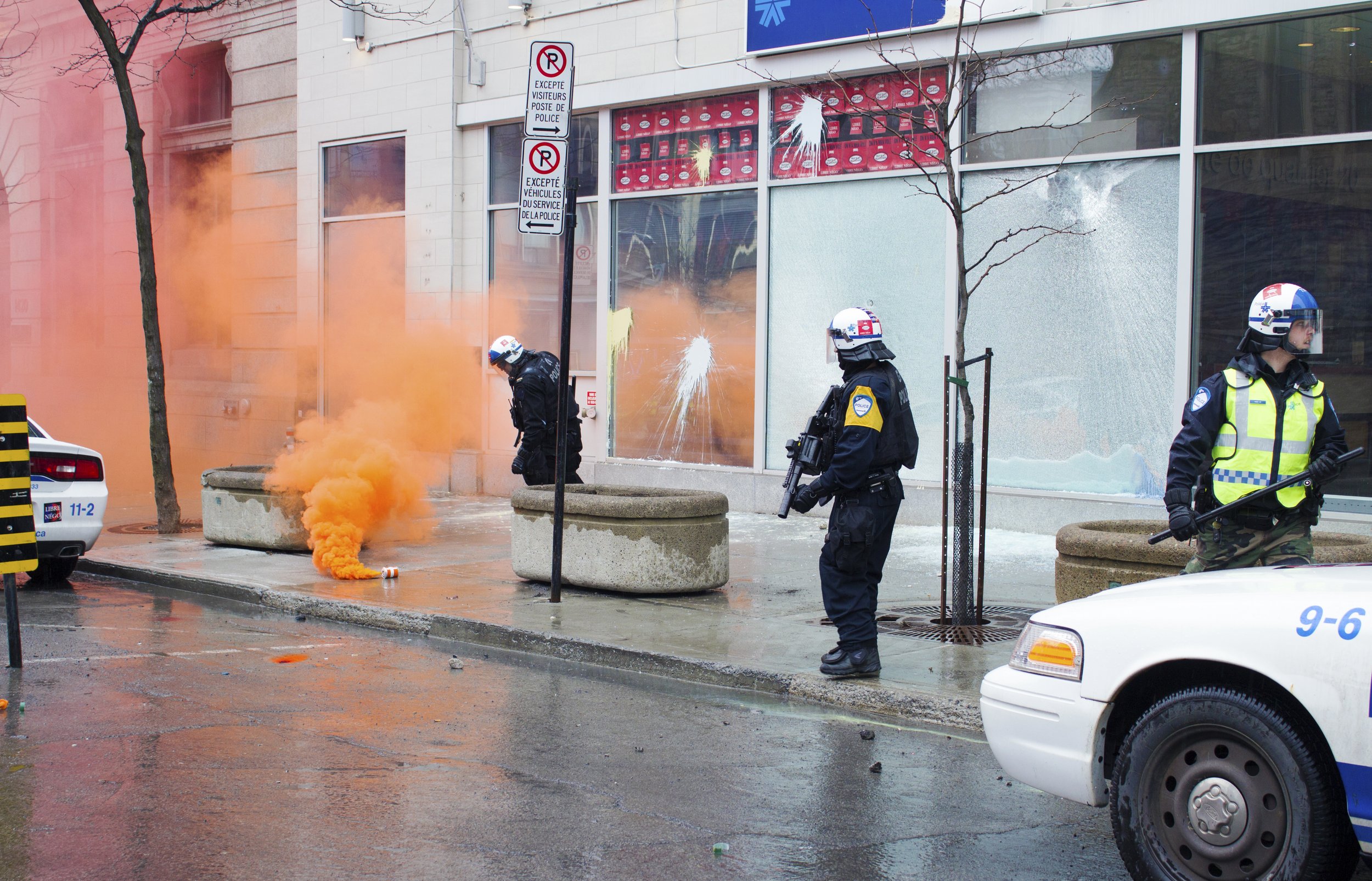  Montreal Police (SPVM) inspect a projectile following the police station coming under attack by demonstrators during a May Day protest. May 1 2016.  