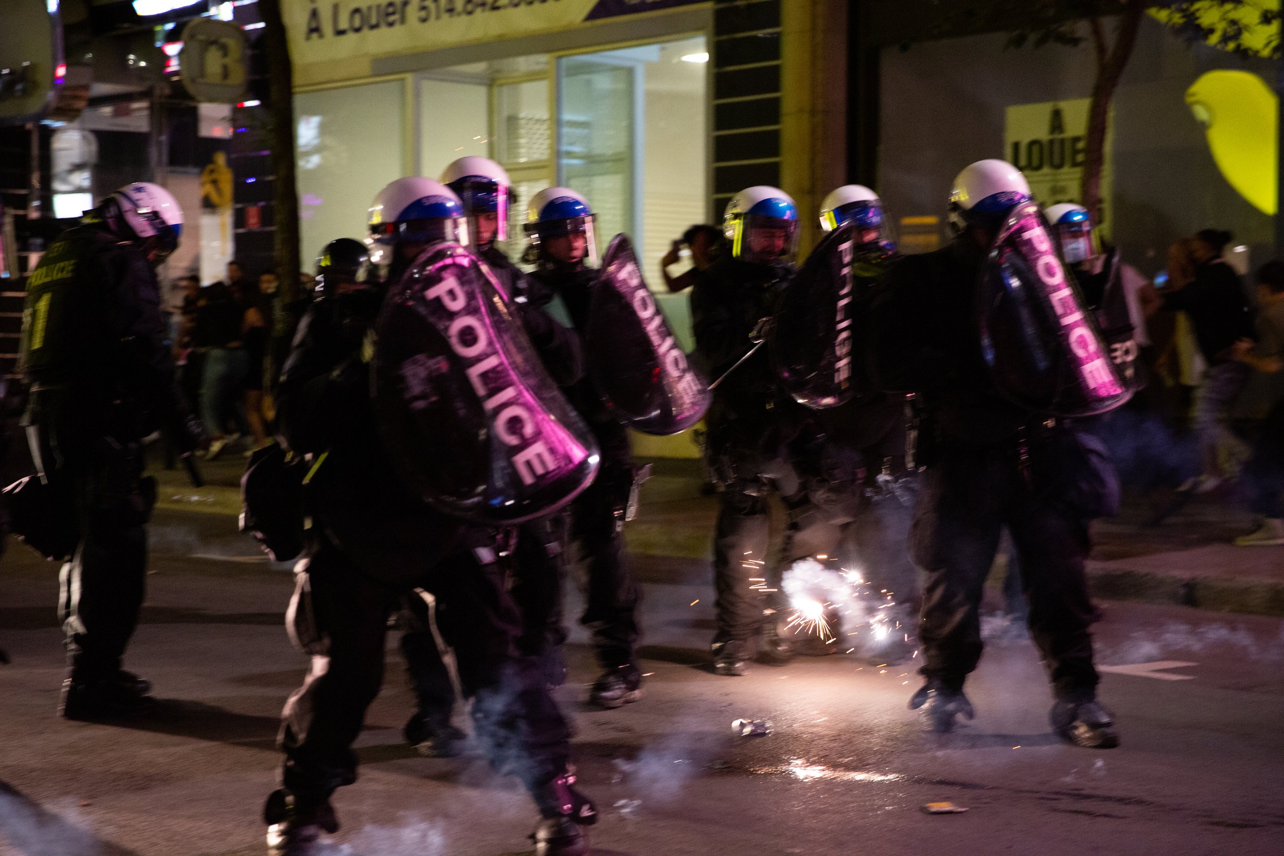  Montreal Police (SPVM) having fireworks shot at them during downtown Montreal celebrations in the aftermath of the team’s win against the Winnipeg Jets. June 24 2021.  
