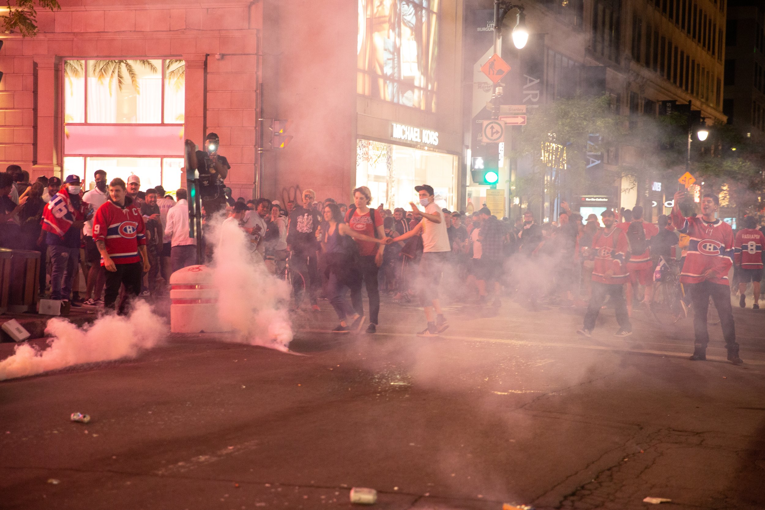  Montreal Canadiens fans moments after receiving volleys of tear gas from the Montreal police (SPVM) following the team’s win against the Winnipeg Jets. June 24 2021.  