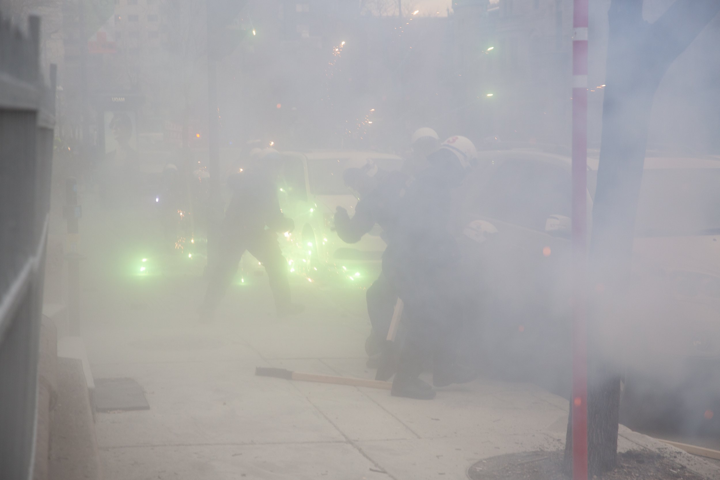  Protesters shooting fireworks at Montreal police (SPVM) during May Day demonstrations. May 1, 2018. 