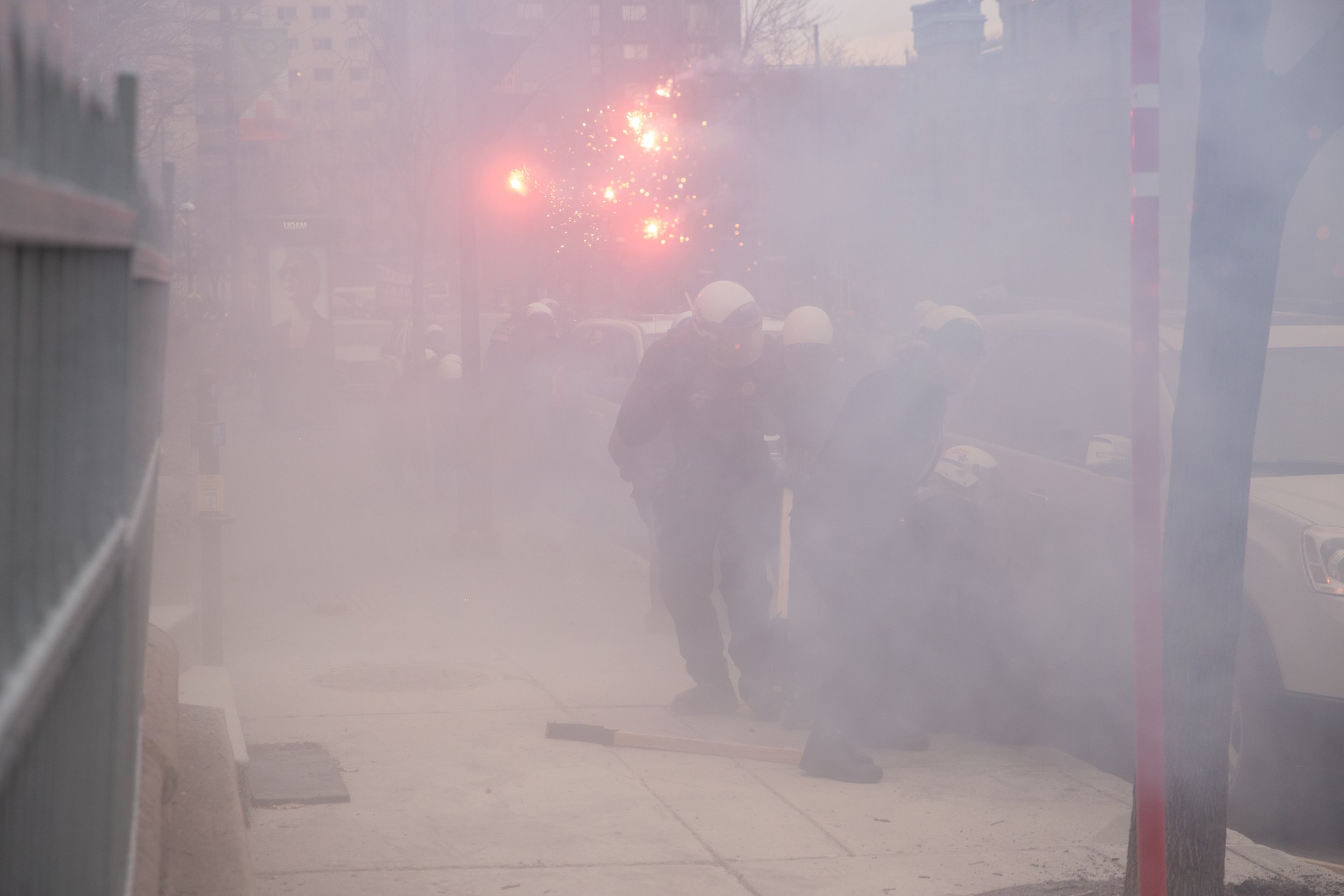  Protesters shooting fireworks at Montreal police (SPVM) during May Day demonstrations. May 1, 2018. 