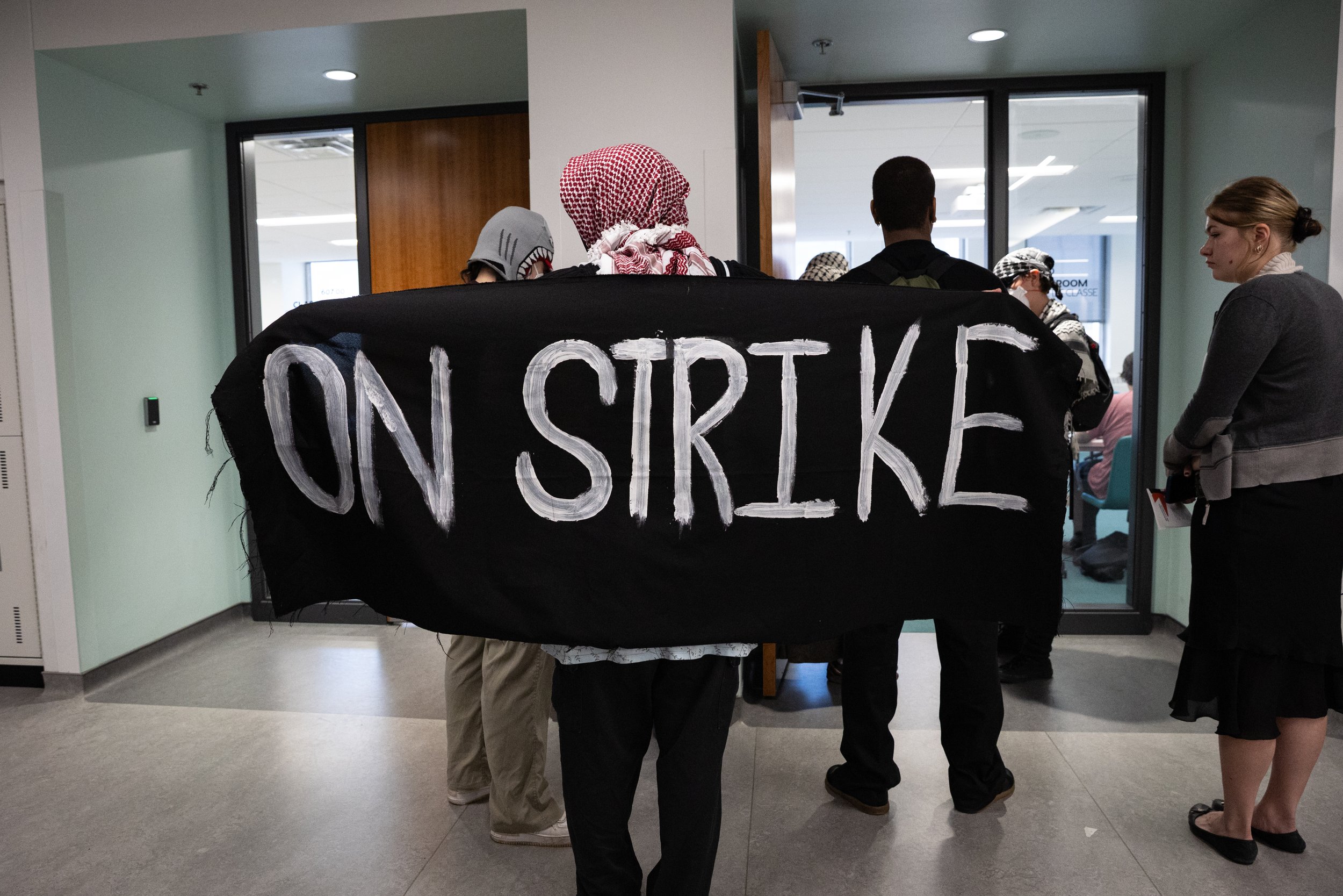  Student demonstrator pickets a Concordia University class during a strike against the university’s ties to Israel. Montreal, Quebec. October 6, 2025.  