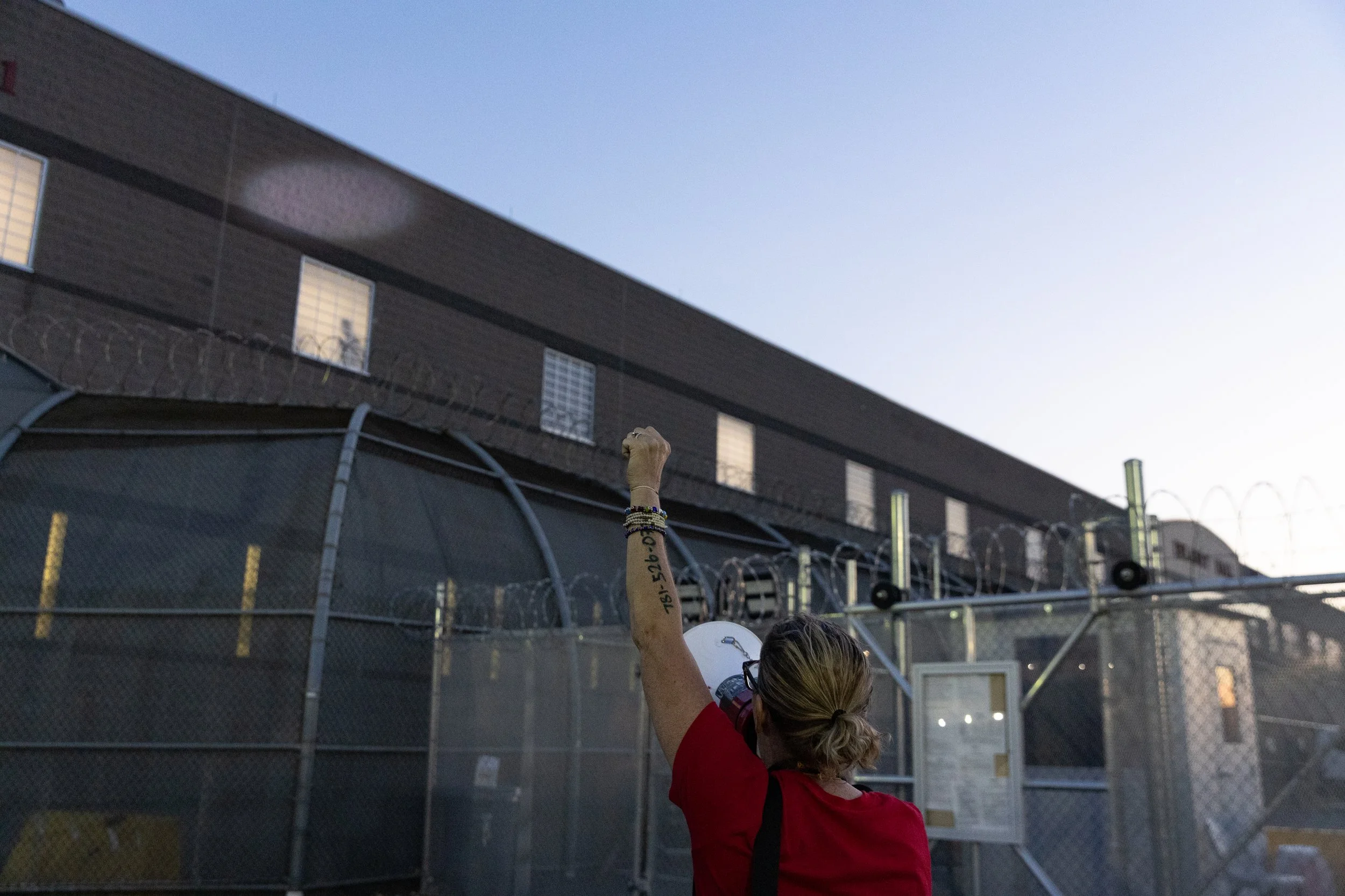  A protester chants into a loudspeaker outside ICE’s Delaney Hall Detention Center. Newark, New Jersey. June 5, 2026. William Wilson.  