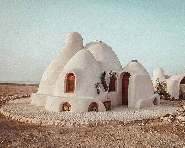 Domes. Organic. Natural building. Built with plastic bags filled with dirt and held together with barbed wire. Domes actually are proven to survive typhoons, earthquakes, and hurricanes.
.
Nader Khalili's SuperAbode home at CalEarth (California Insti