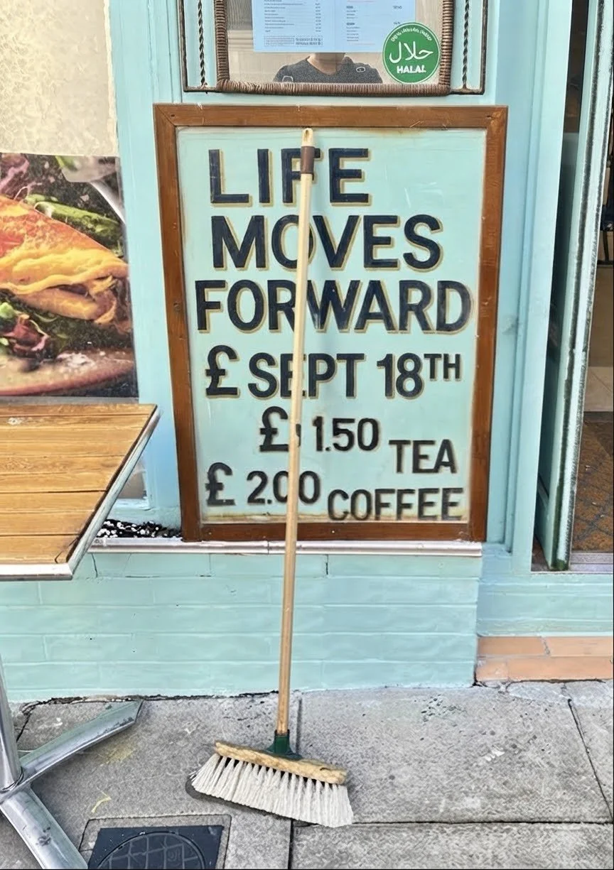 A London cafe sign featuring the title of the latest single by Steve Mahoney & The Mill Island Band, Life Moves Forward (2026)