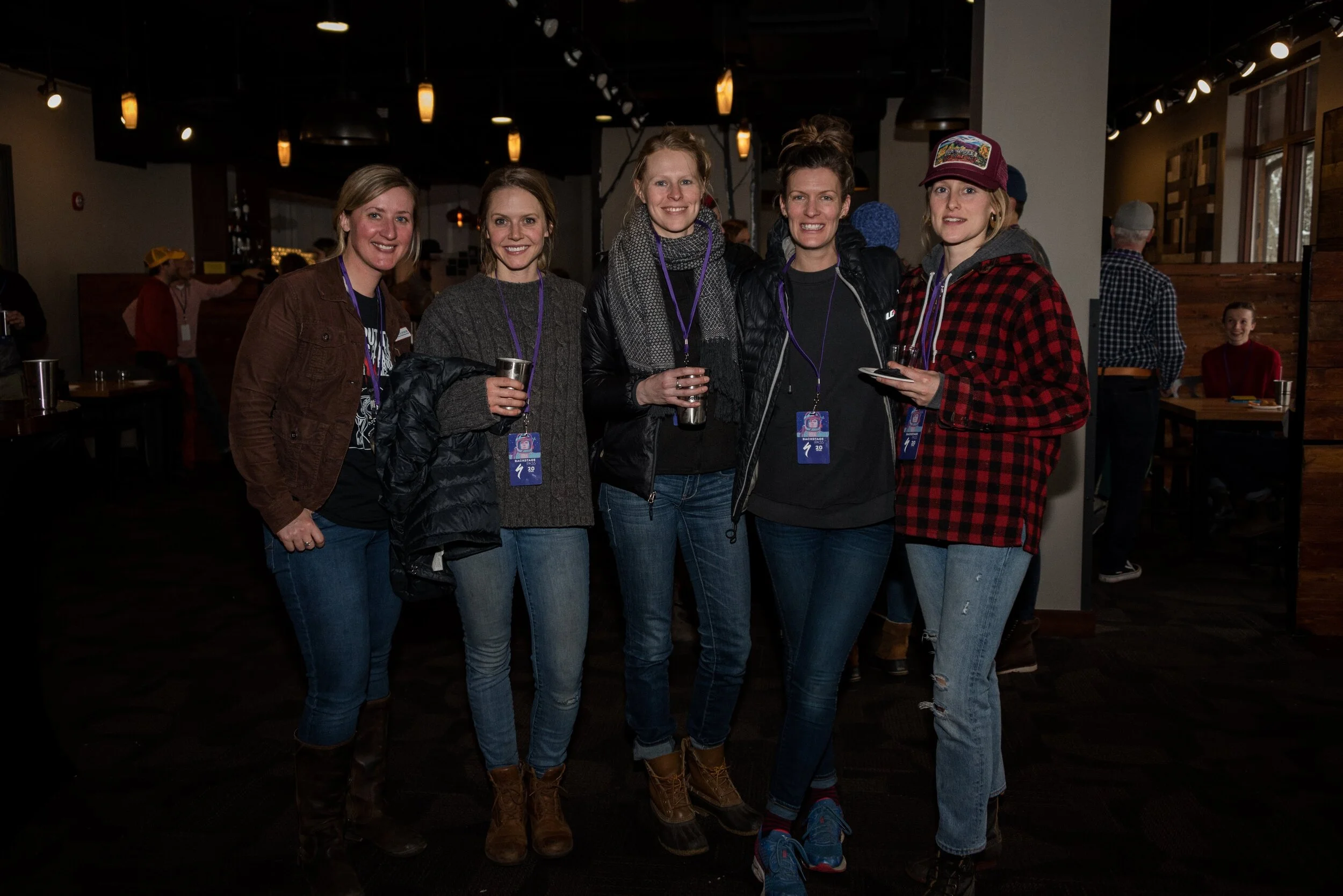 Jessica Sechler (far left) poses with the Craftsbury General Store at Rasputitsa’s Friday night event.