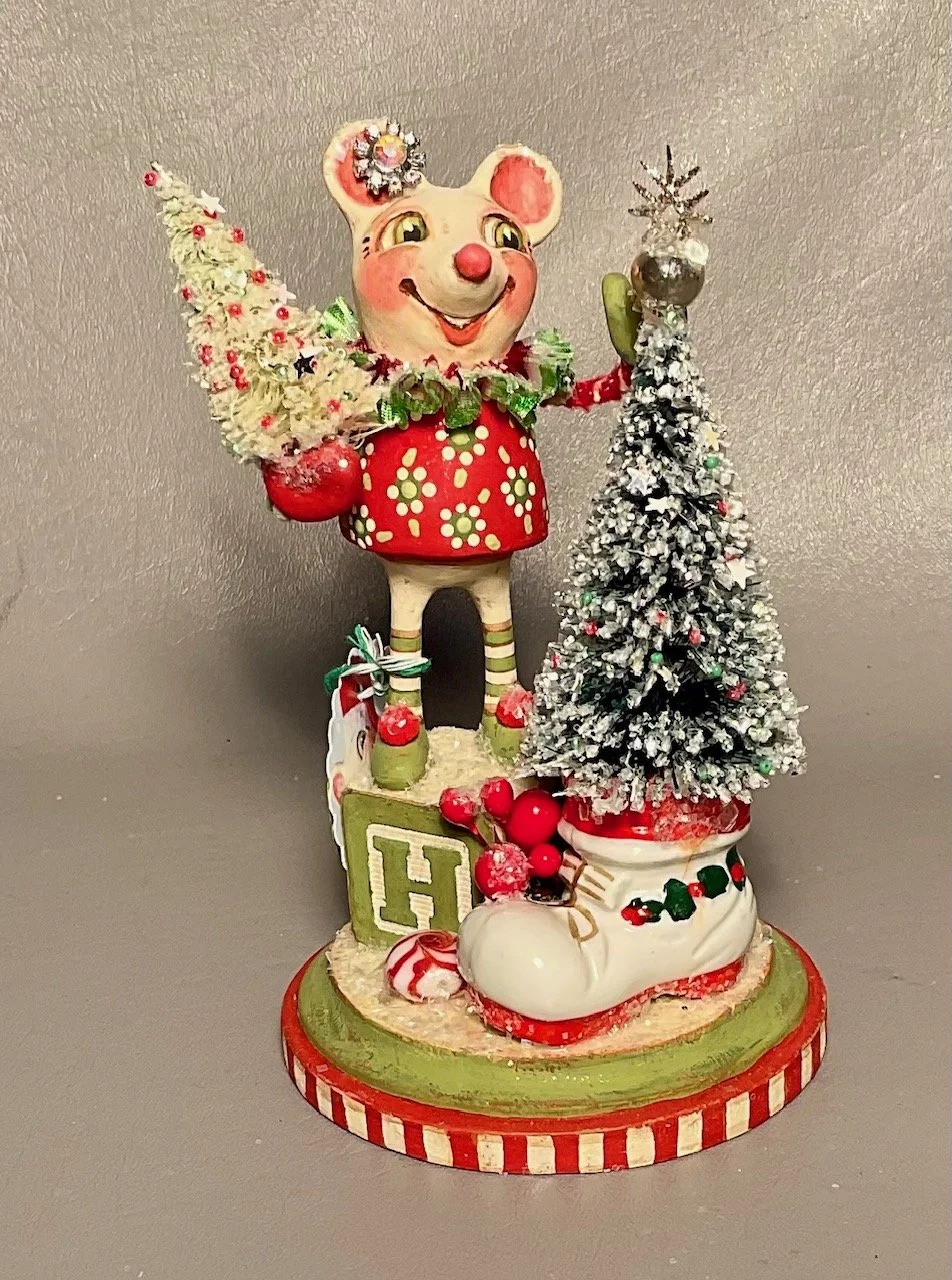 Happy Noel~Girl Mouse with vintage ceramic boot, “H” block, vintage treasures on 4” diameter wood base. $155.00