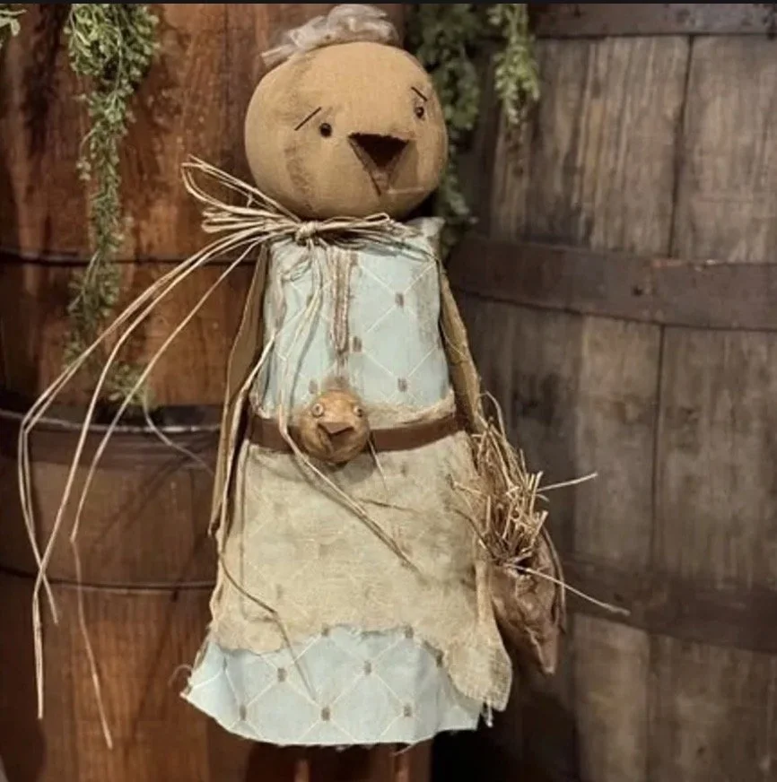 Momma Chick ~Wearing a duck necklace made of clay, holding her feed bag, vintage blue dress  20” tall $80.00