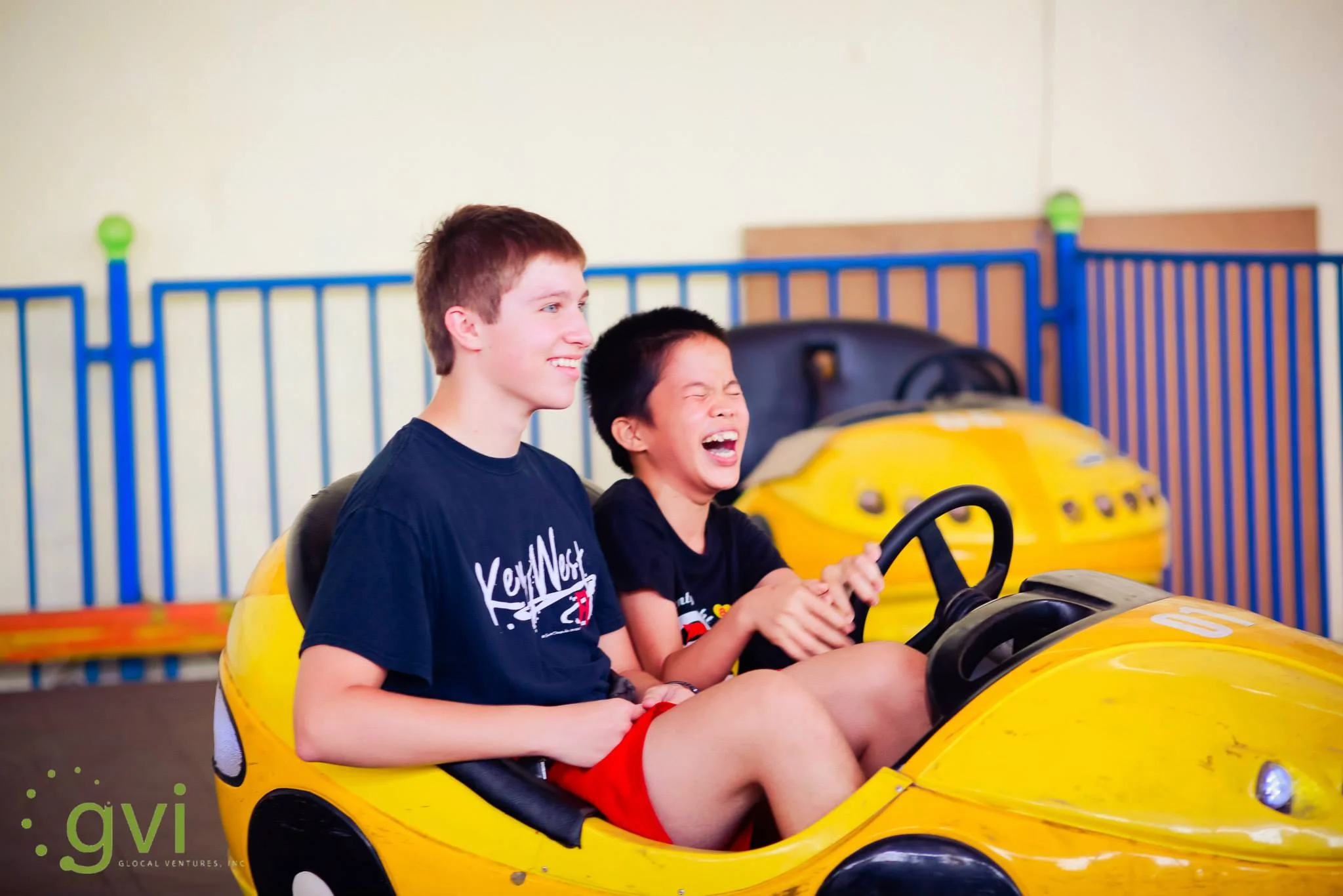 Huy and Weston in a bumper car during the first trip in 2015