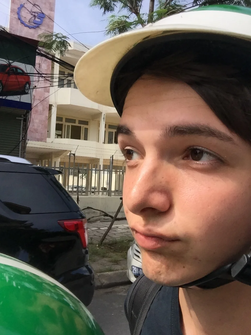This tasteful selfie shows my altitude compared to everyone else on the road, including the driver, whose head, as you can see, only goes up to my chin.