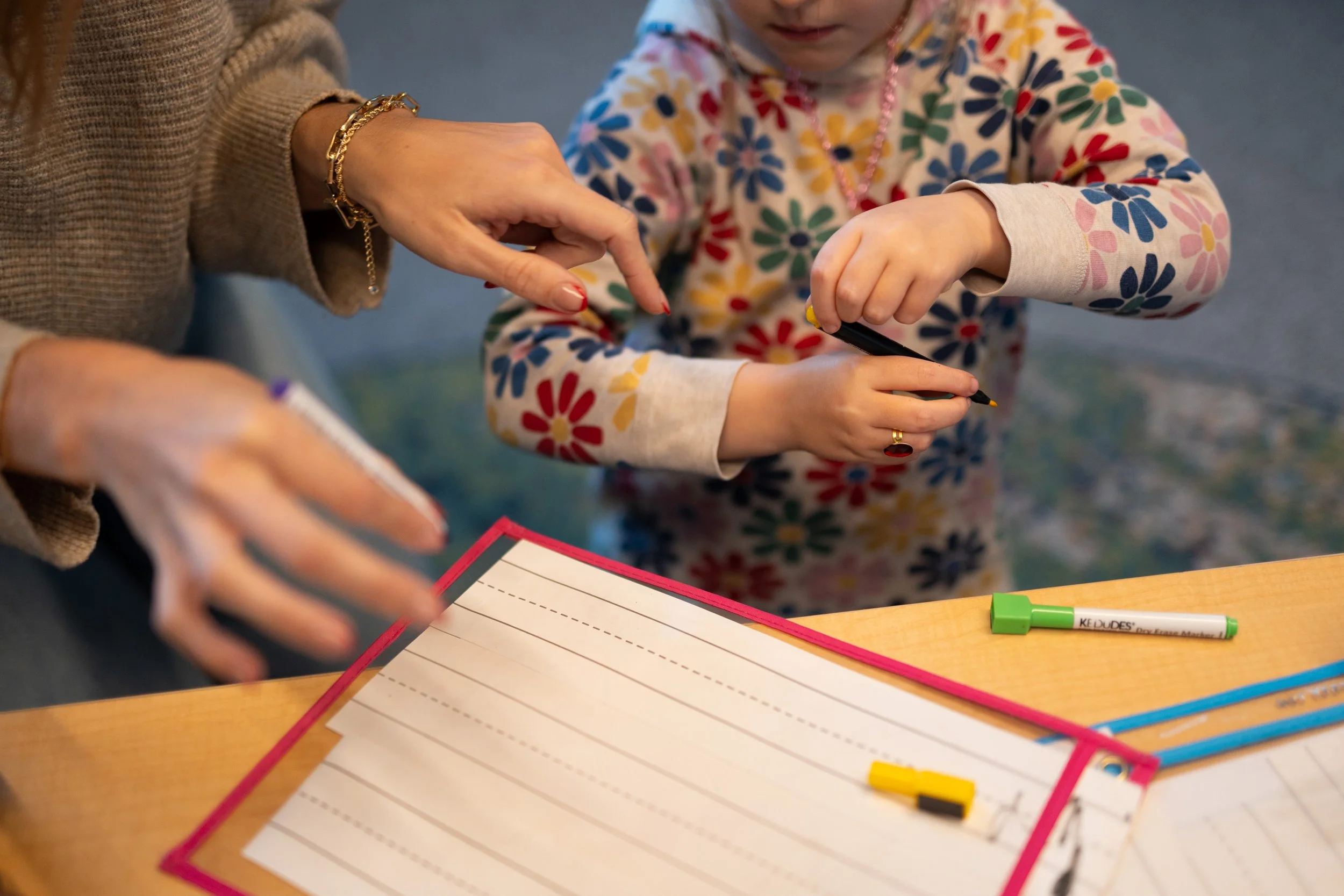 Preschool child learning how to hold a pencil, pencil grasp tricks for preschoolers