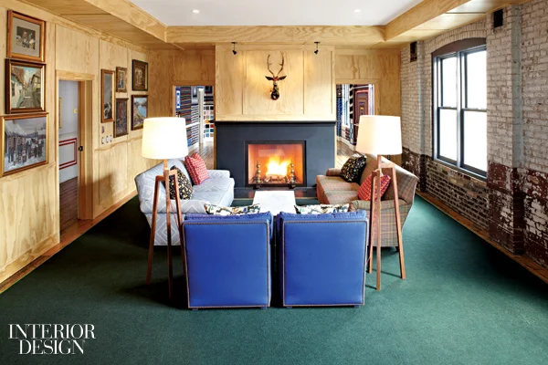 409120-The_living_room_one_of_the_event_spaces_is_paneled_in_plywood_and_furnished_with_custom_sofas_by_Janet_Gridley_and_a-1.jpg