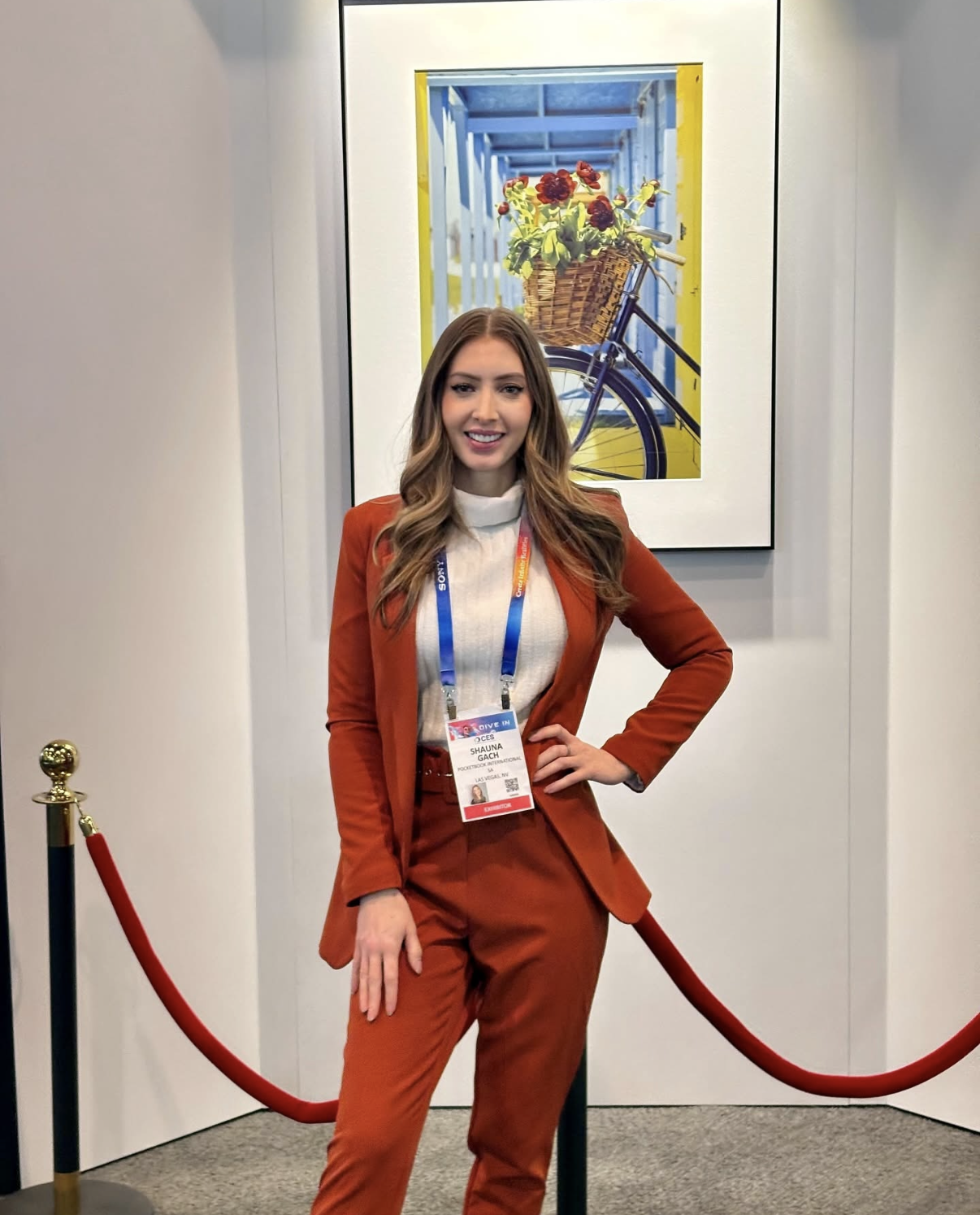 Professional brand ambassador promoting a technology brand at a Las Vegas trade show and convention booth.
