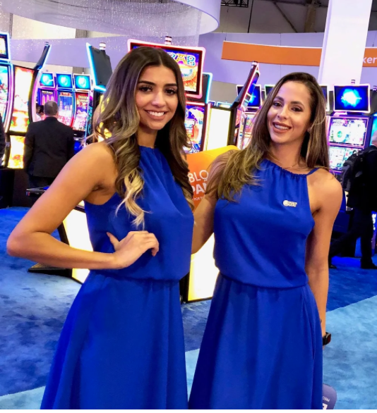 Premium Las Vegas trade show models and booth staff representing a corporate brand at a convention