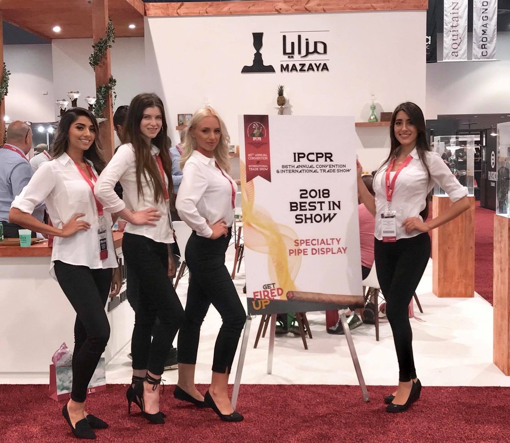 Trade show models representing a brand at a convention booth