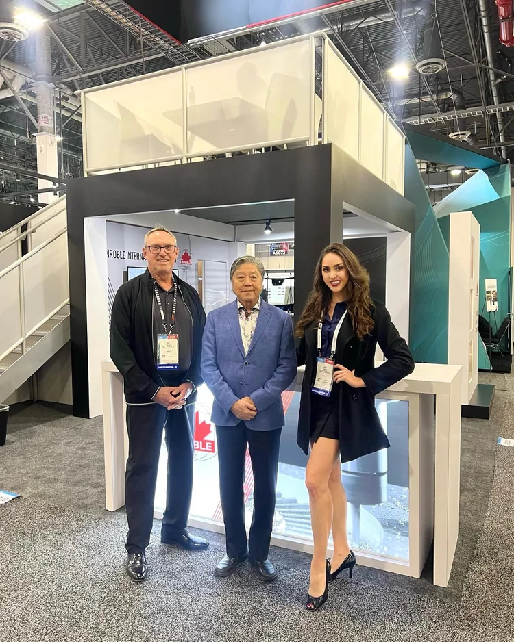 Trade show models executing booth promotions