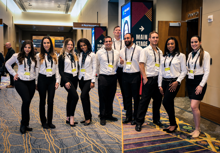 Polished Las Vegas convention staff managing event support logistics at Unleash conference