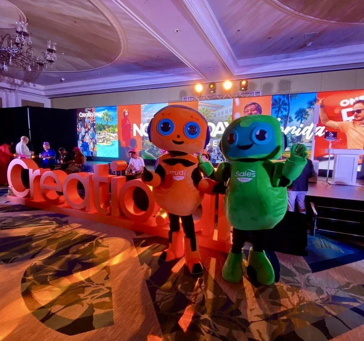 Mascot character interacting with event attendees