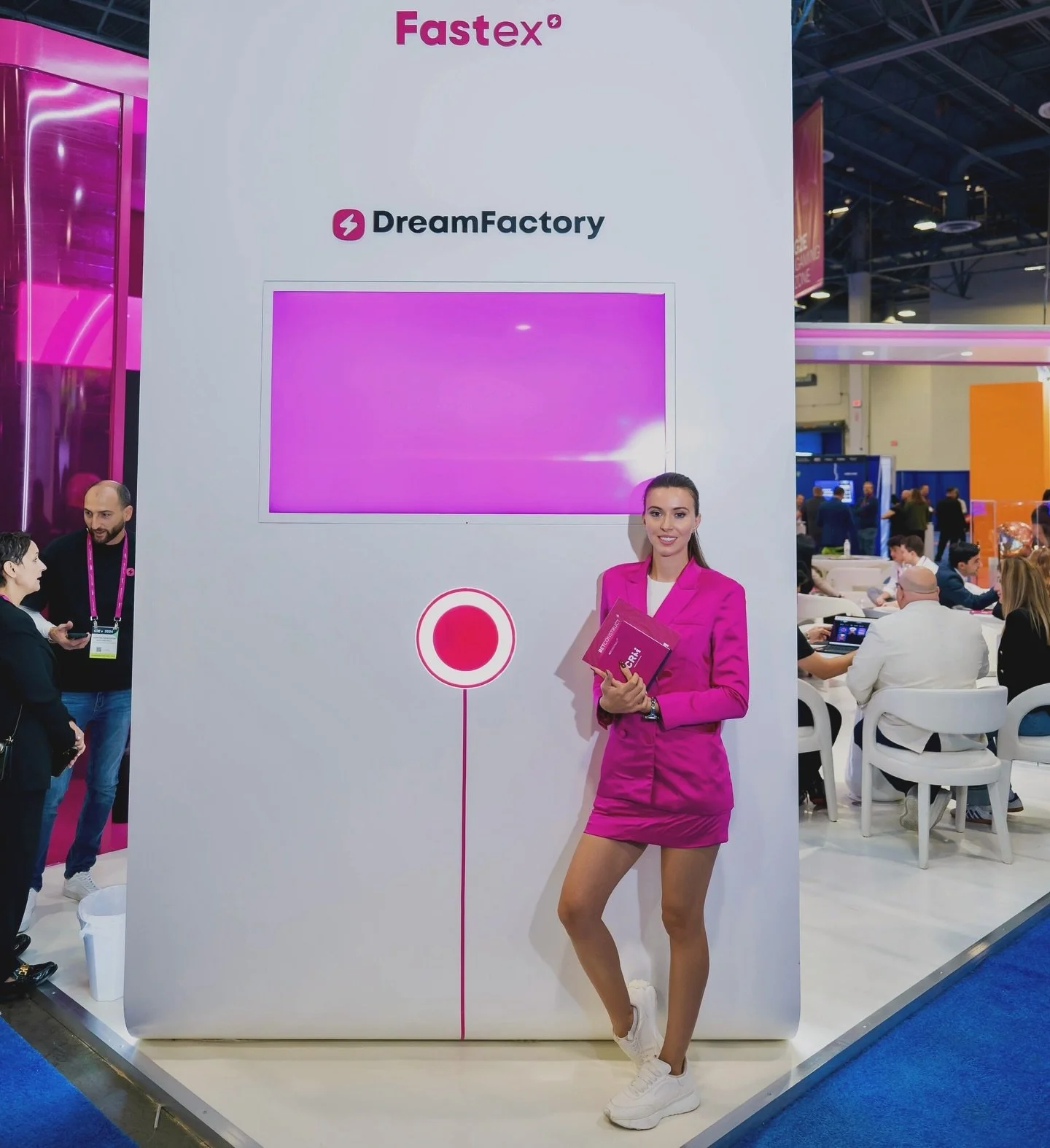 Professional brand ambassador promoting a technology brand at a Las Vegas trade show and convention booth.