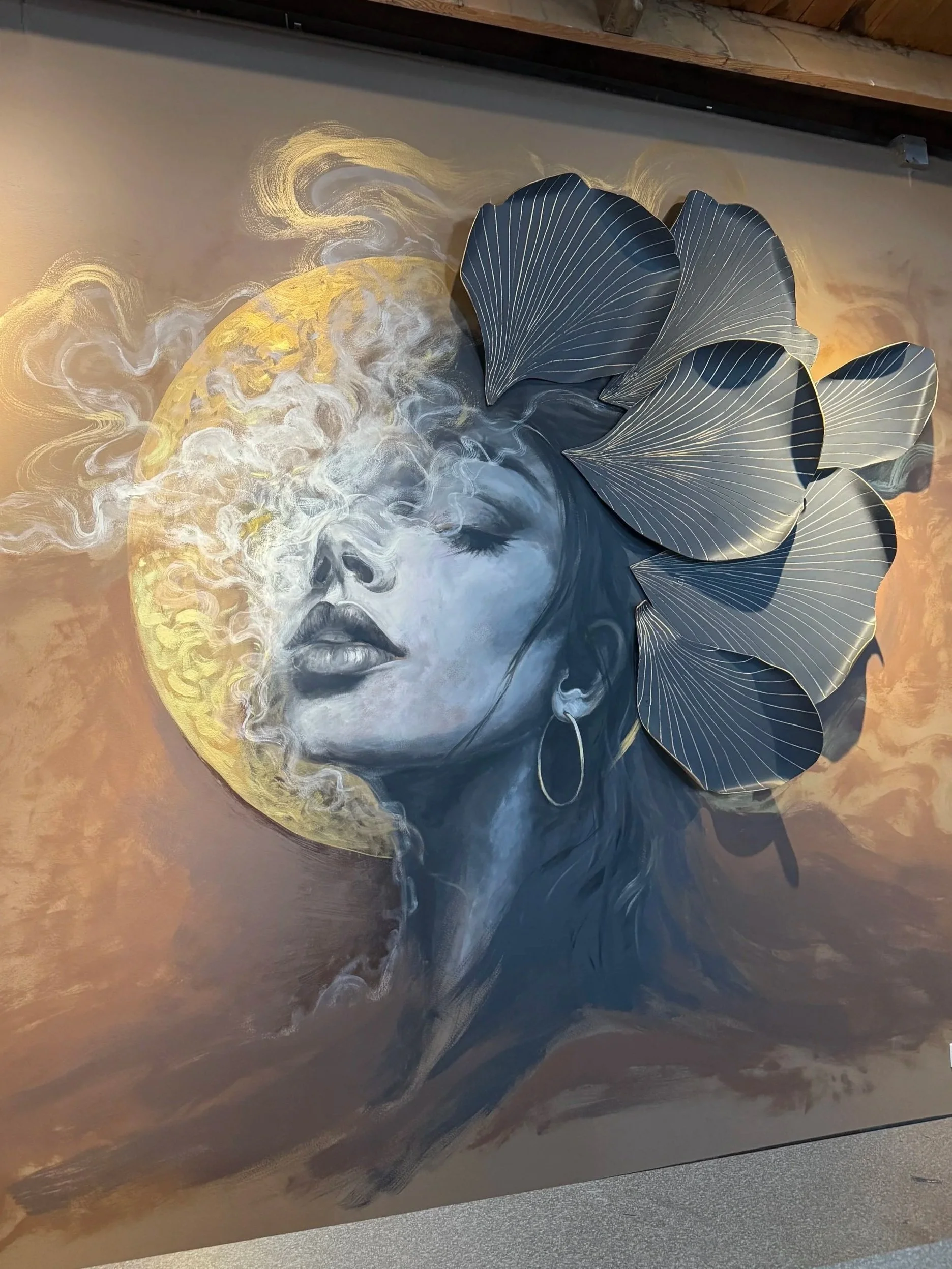 Hand-painted dimensional artwork with sculptural floral elements extending beyond the surface of the painting.