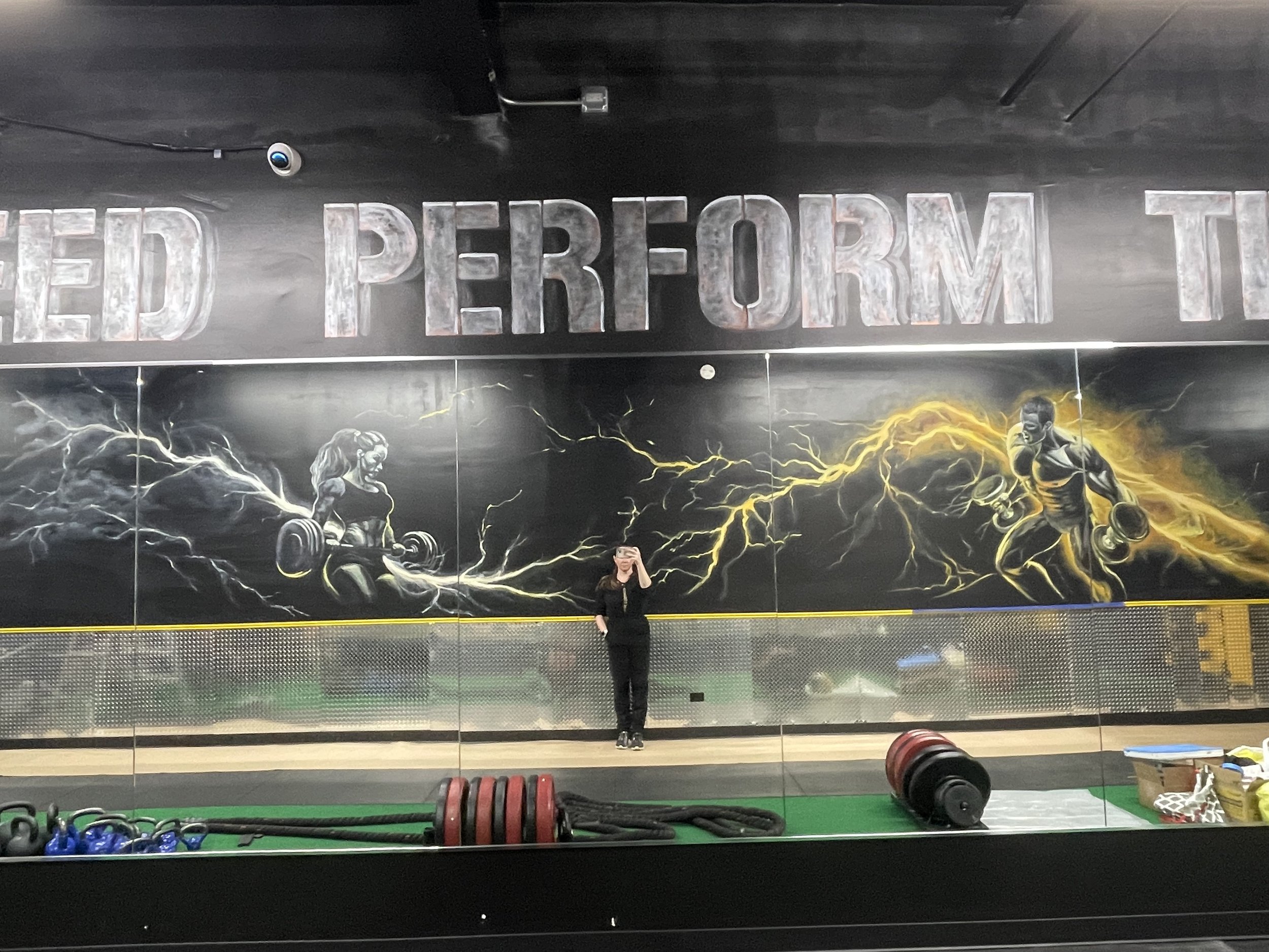Finished custom mural integrated into the interior of a professional performance gym.