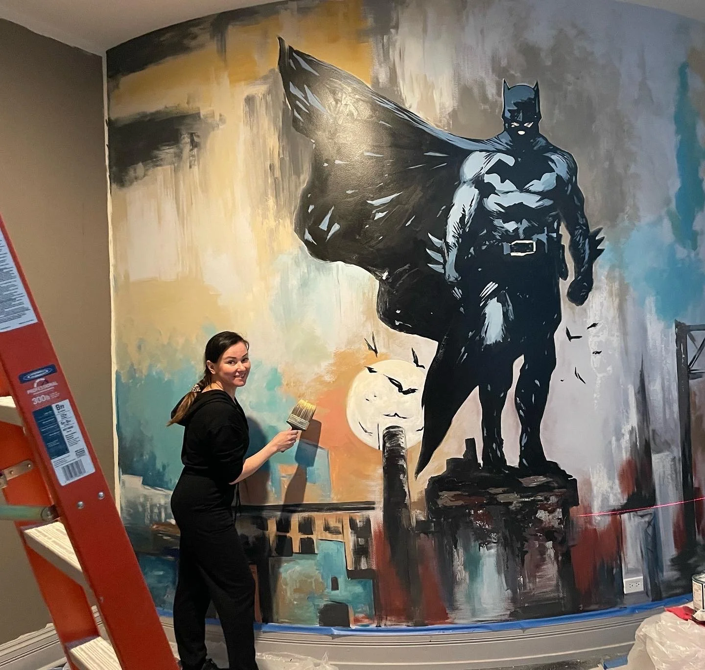 Custom Batman mural painted in a private home gym by AiNi Art Studio