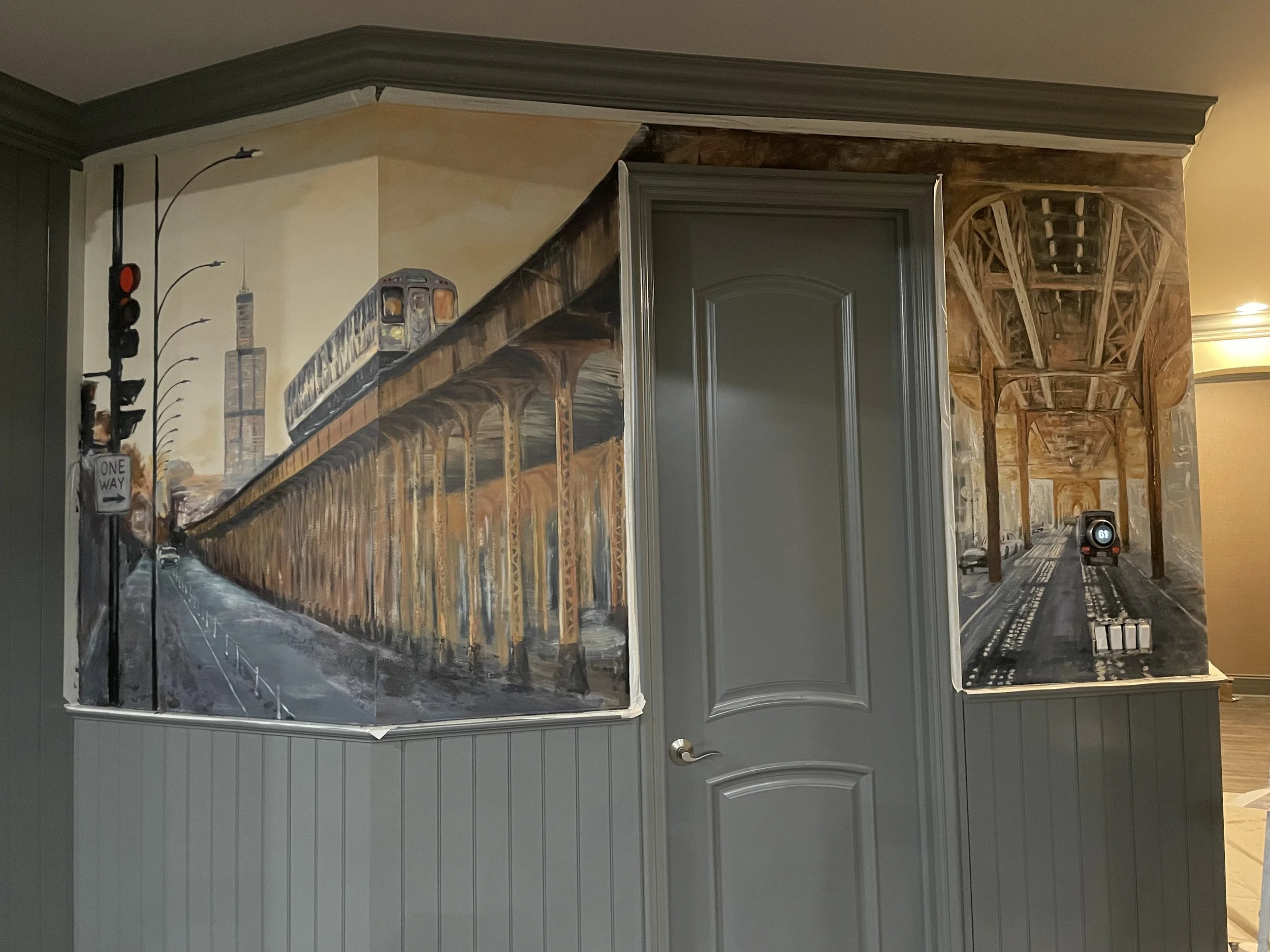 Hand-painted Chicago cityscape mural wrapping around an interior wall