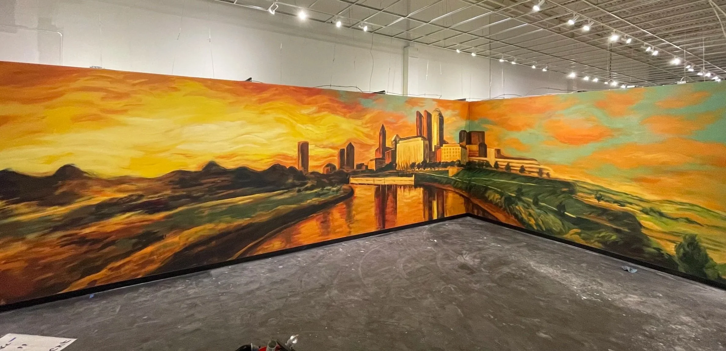 Large-scale cityscape scenic mural created by Anna Yakimenko for the Immersive Van Gogh exhibition in Columbus.