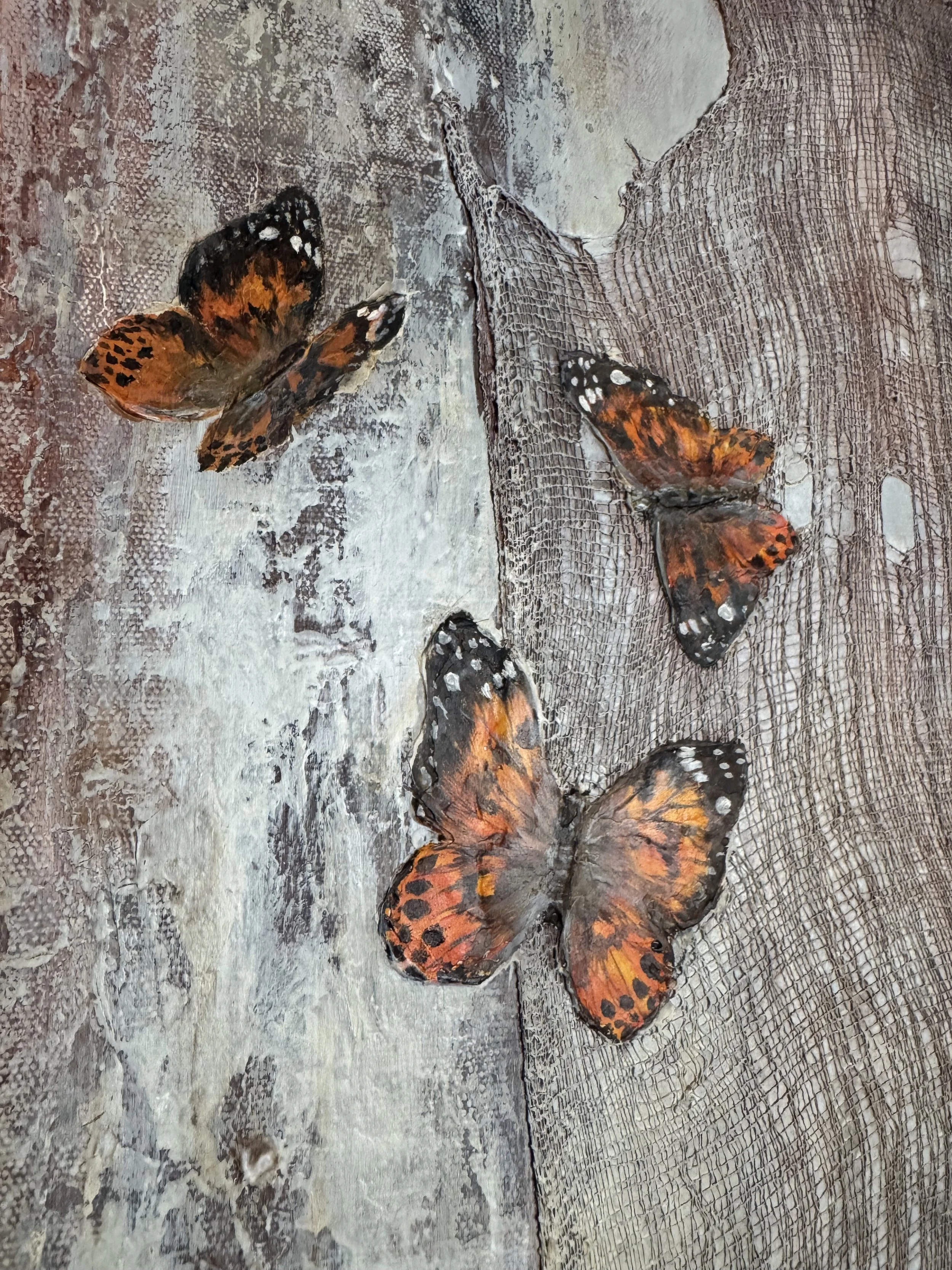 Textured surface and butterfly details in the mixed-media artwork Between Earth and Air.