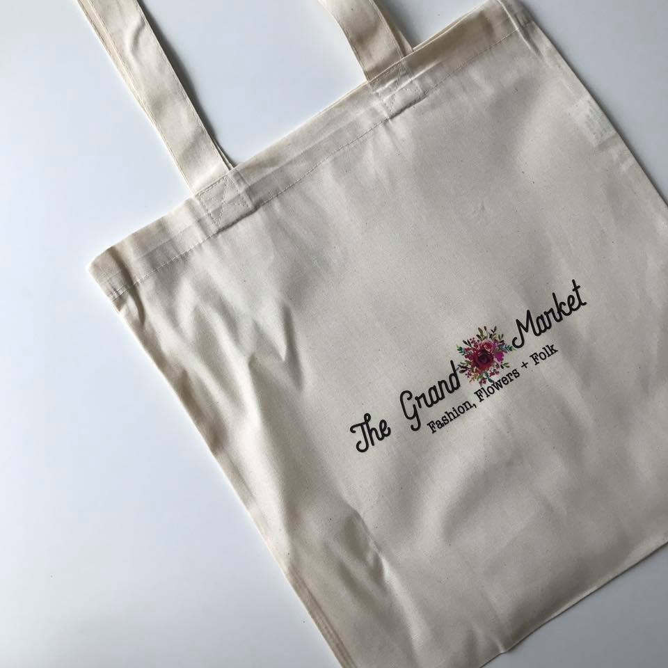 Tote bag holding all of the gifts given to the first 100 guests at the event on Sunday morning.