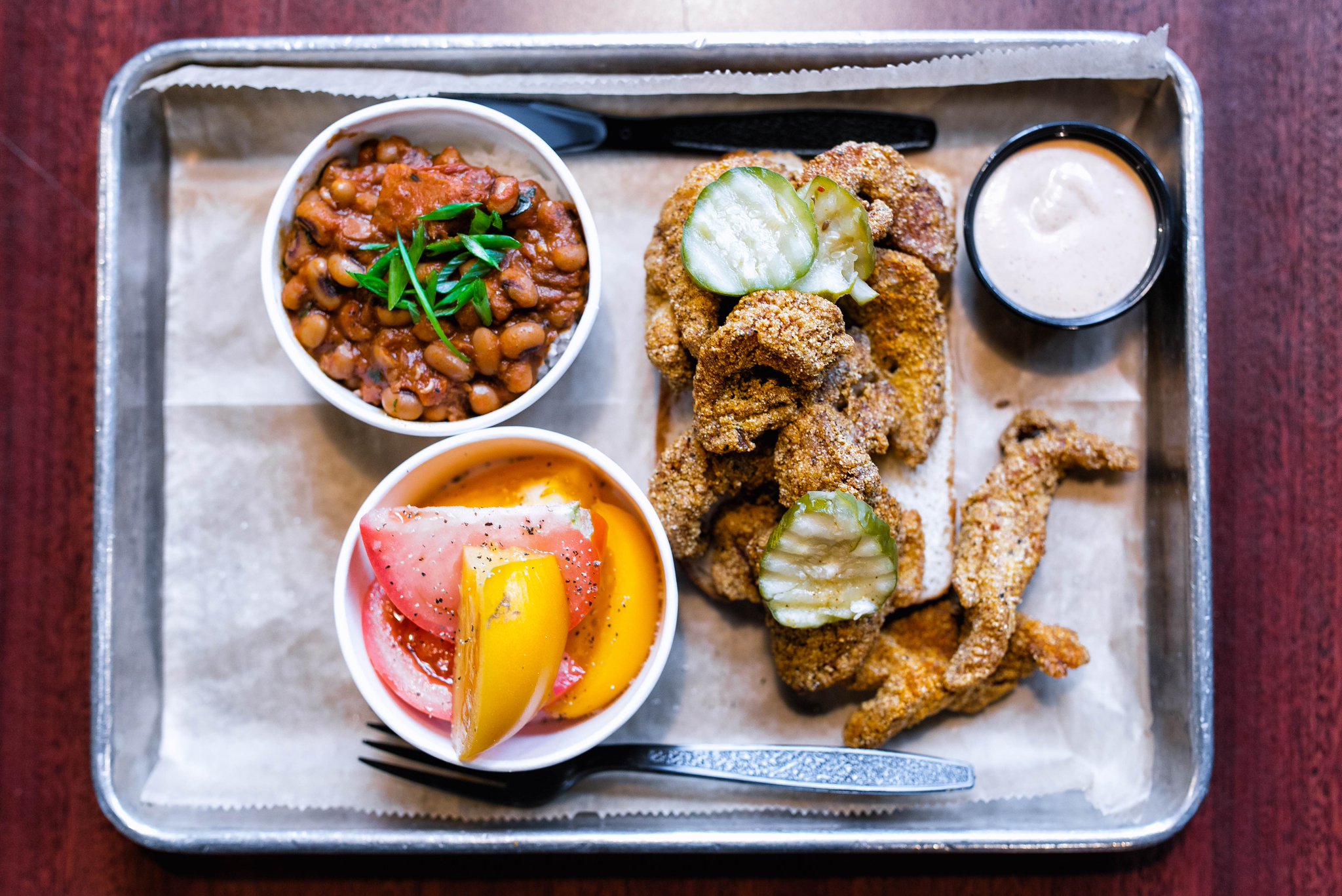Styrofoam plates may have been traded in for trendier metal trays, but the plastic silverware reminds you that this is pure, classic southern food. 