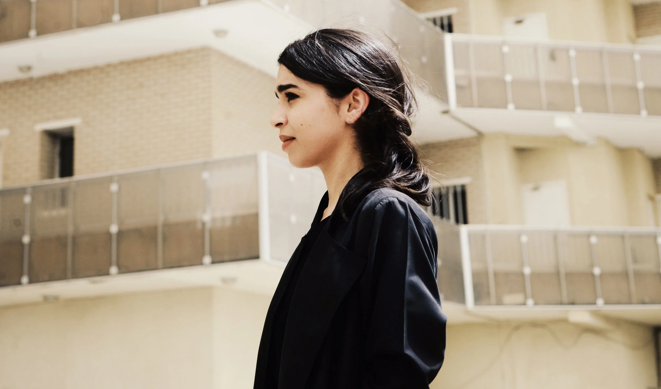 In front of Greek-French architect George Candilis’ award winning Aisha Salem Complex in Kuwait, where Alia lived as a child. Photo taken by Aziz Mutawa
