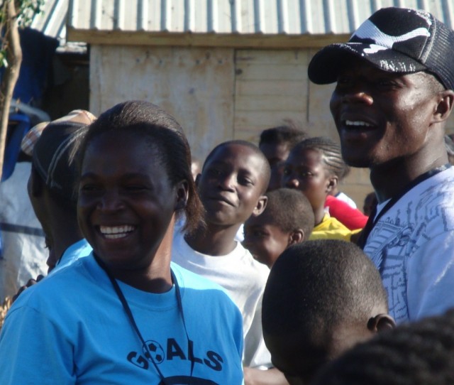 Nadege, Senior Program Manager, and Coach Elbrone enjoy a match