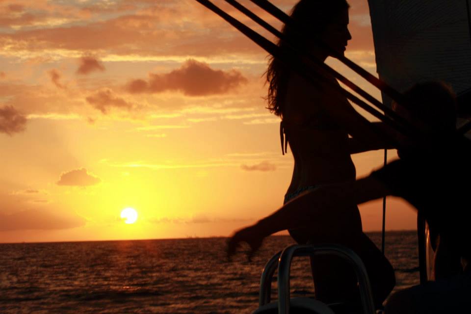  Sillohette of girl on boat during sunset 