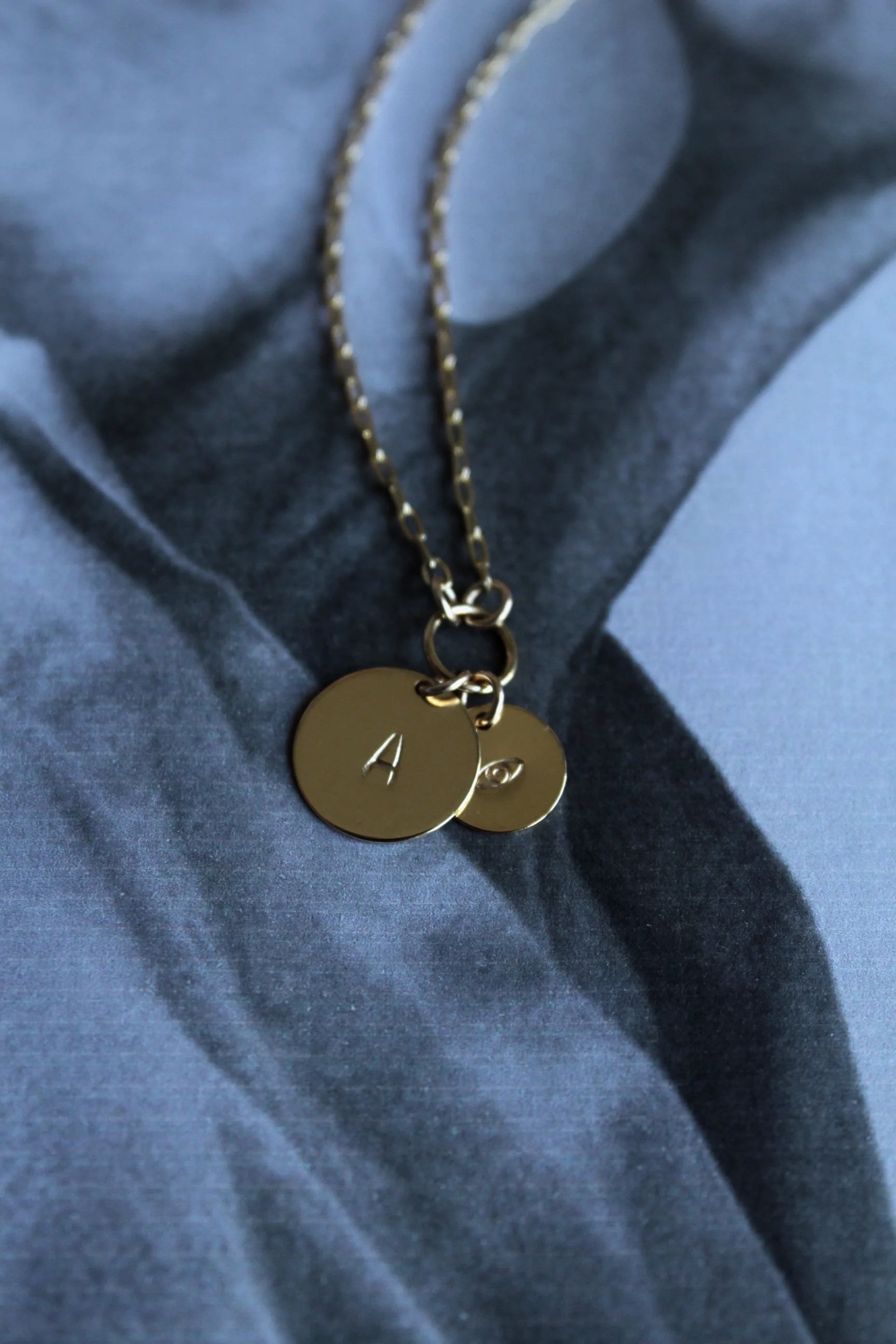 14ct gold filled paper chain necklace with custom hand stamped Initial disc and evil eye protective talisman.