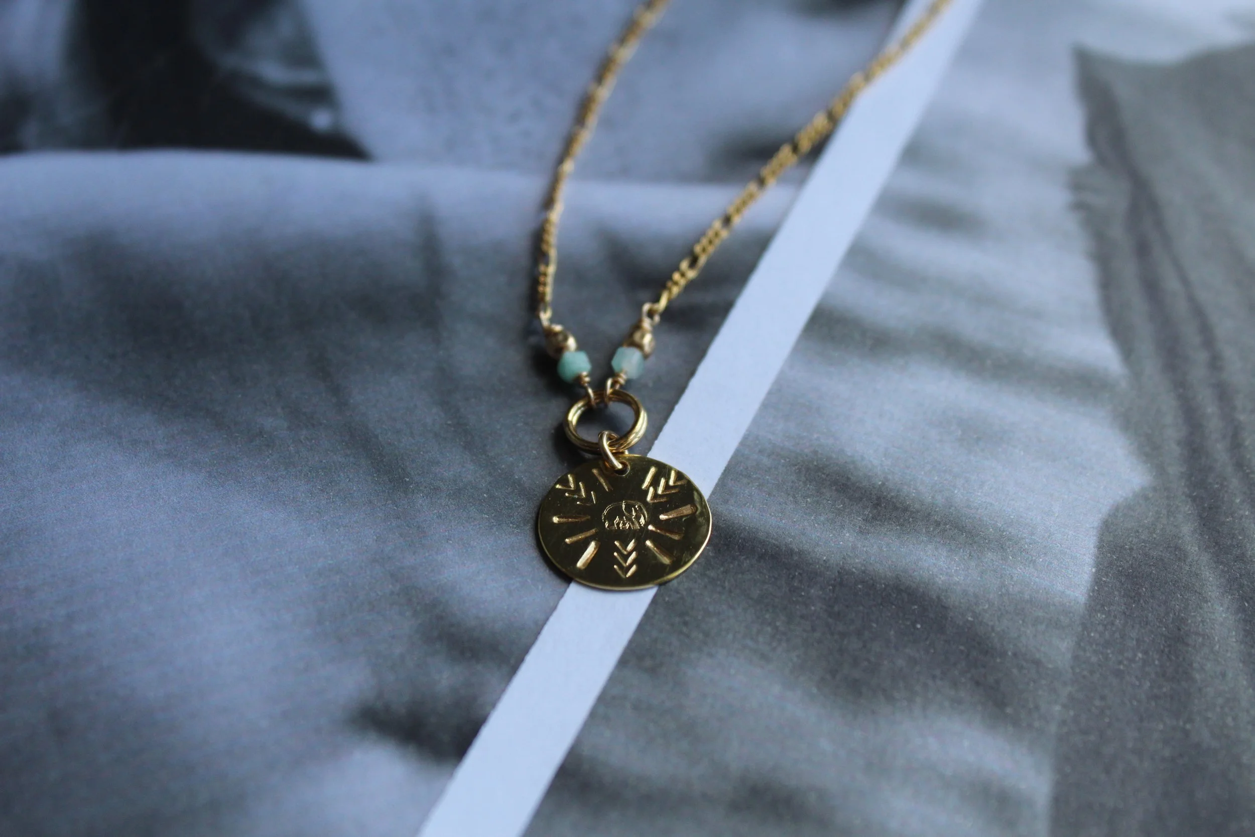 14ct gold filled elephant disc  with Larimar and gold filled Figaro chain detail.