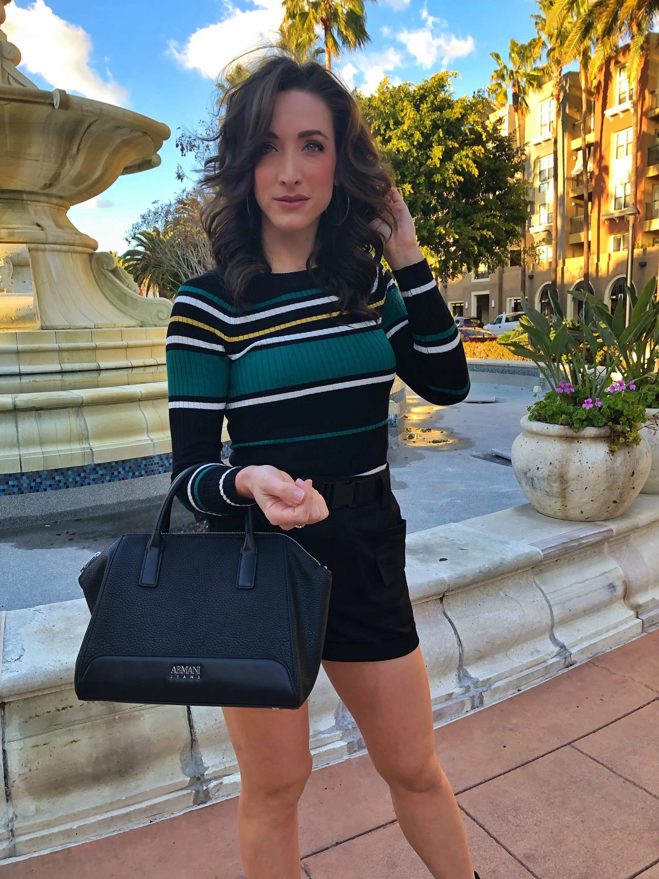 Olivia Culpo Express High Waisted Cargo Shorts. Black Leather Armani Tote.