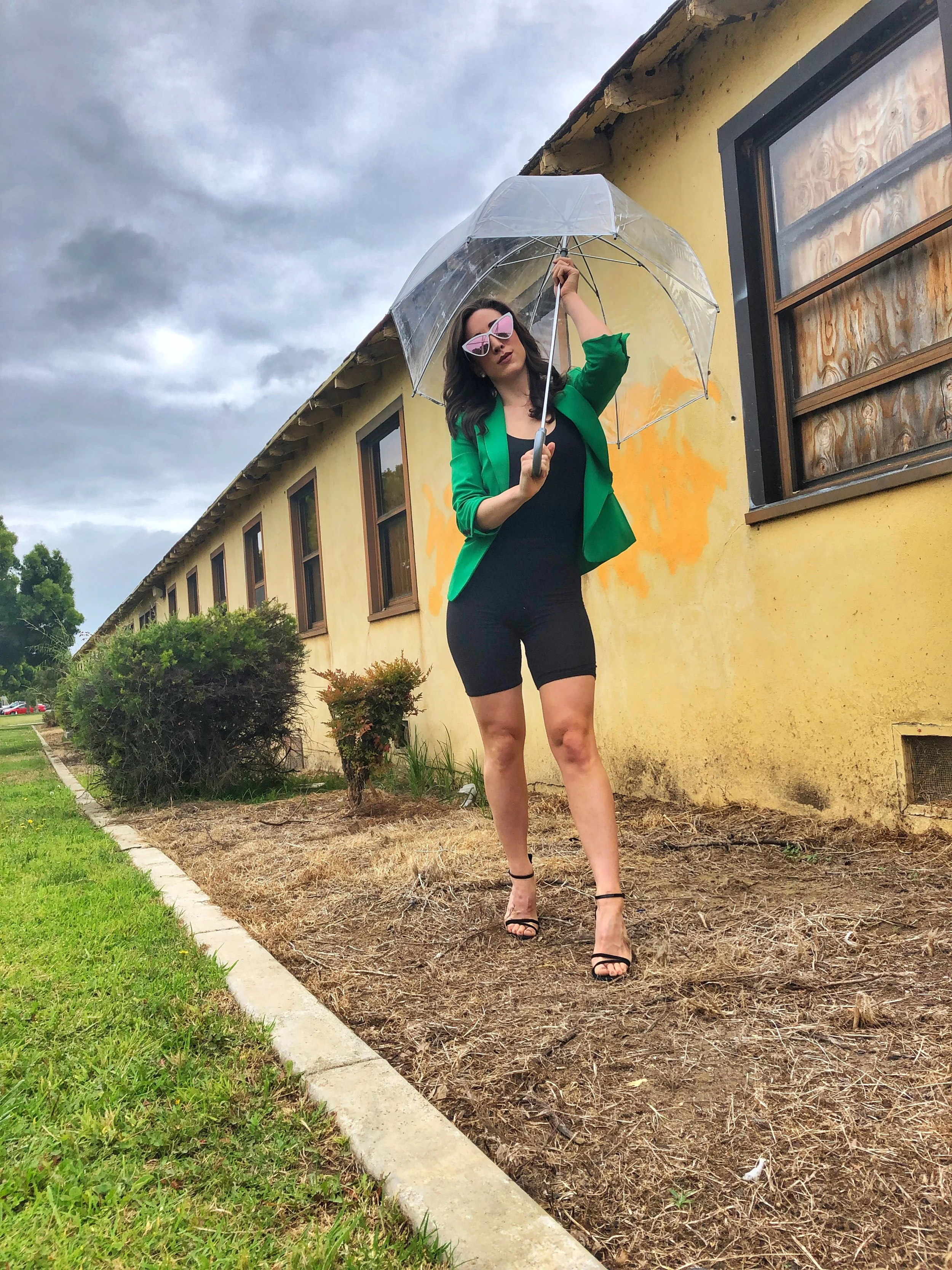 Totes Clear Umbrella. Green Blazer. Bike Shorts. Schutz heels.