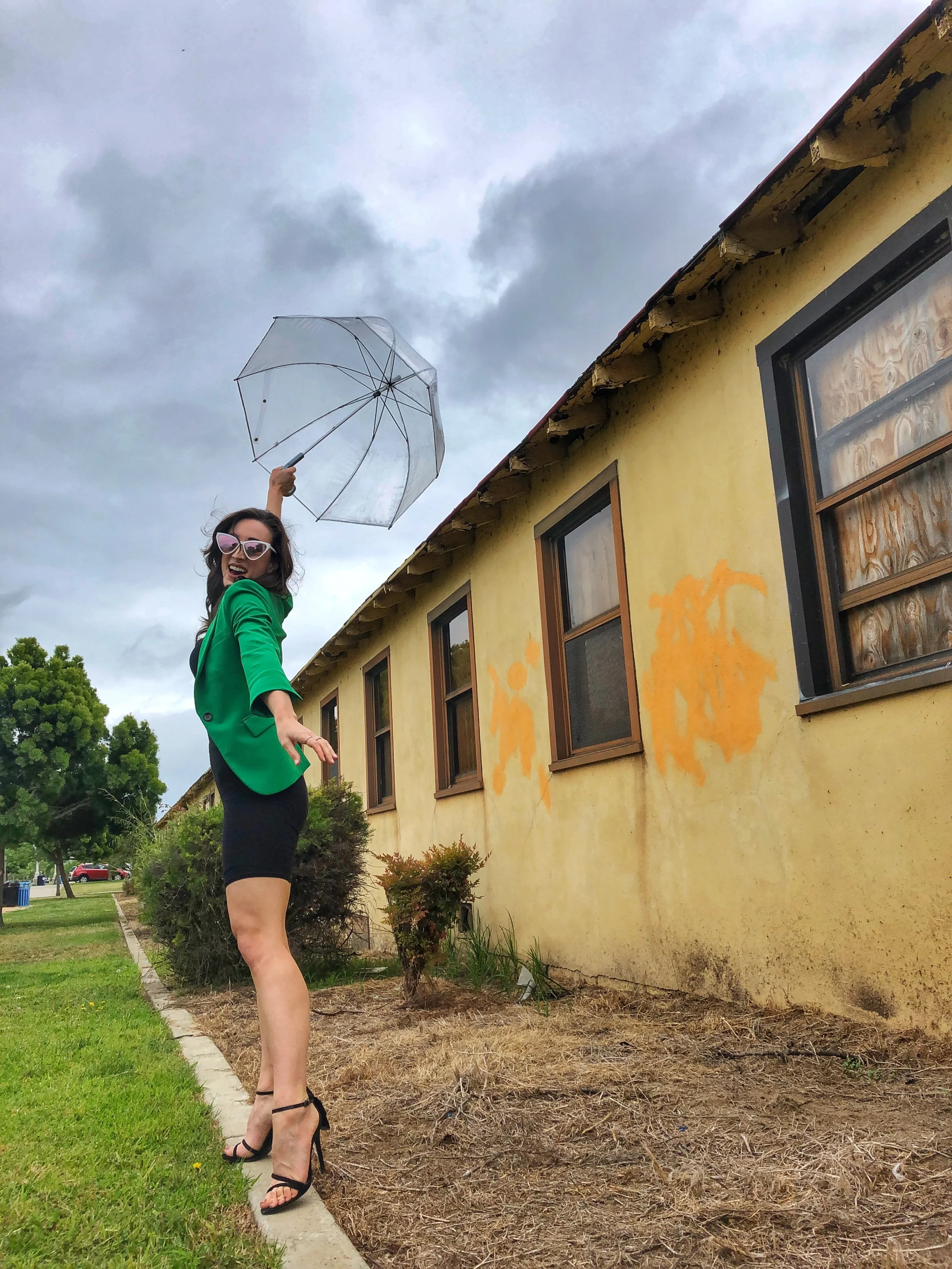 Totes Clear Umbrella. Green Blazer. Bike Shorts. Schutz heels.